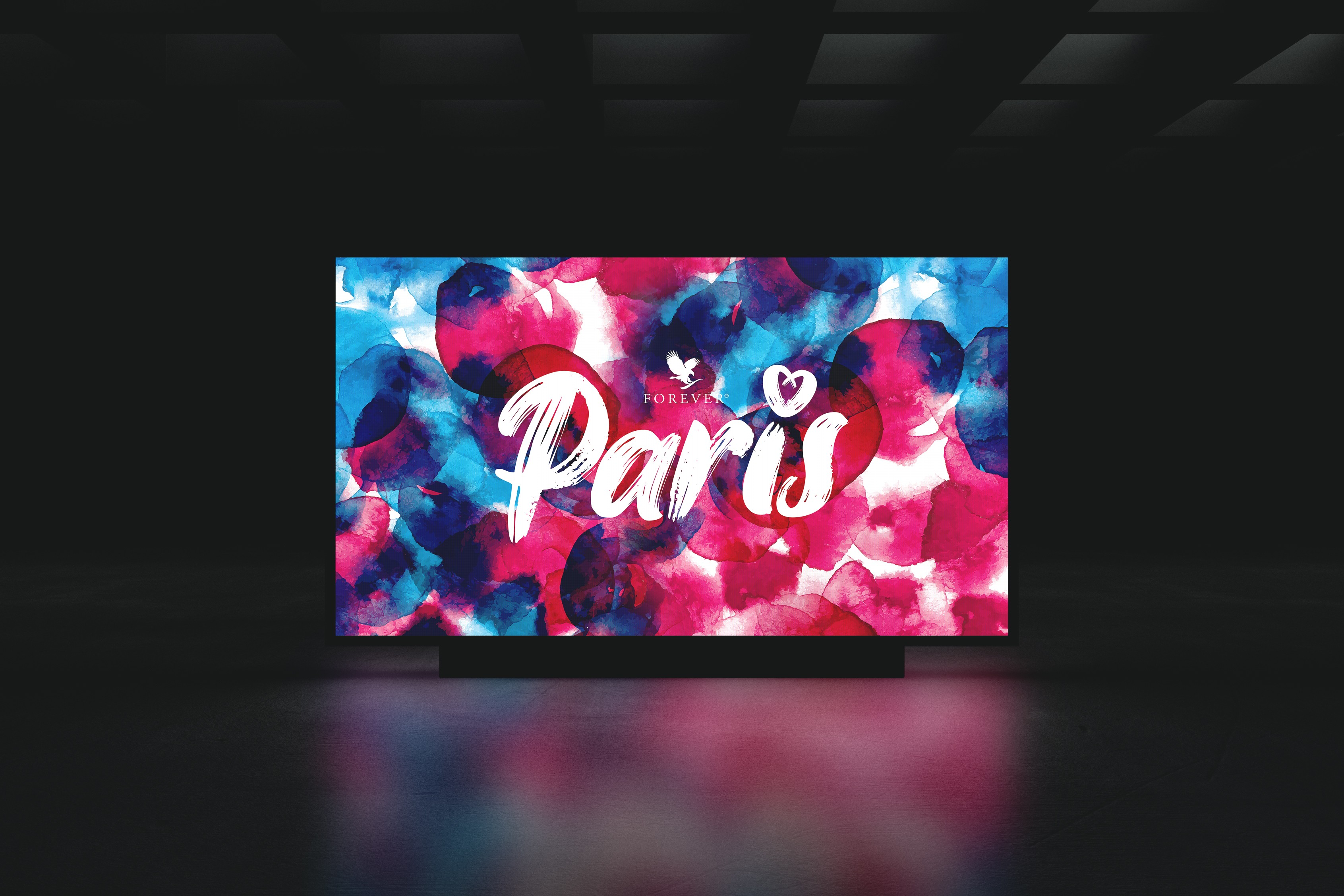 Large scale digital screen showcasing the Forever Living FGR25 Paris event logotype in script font.