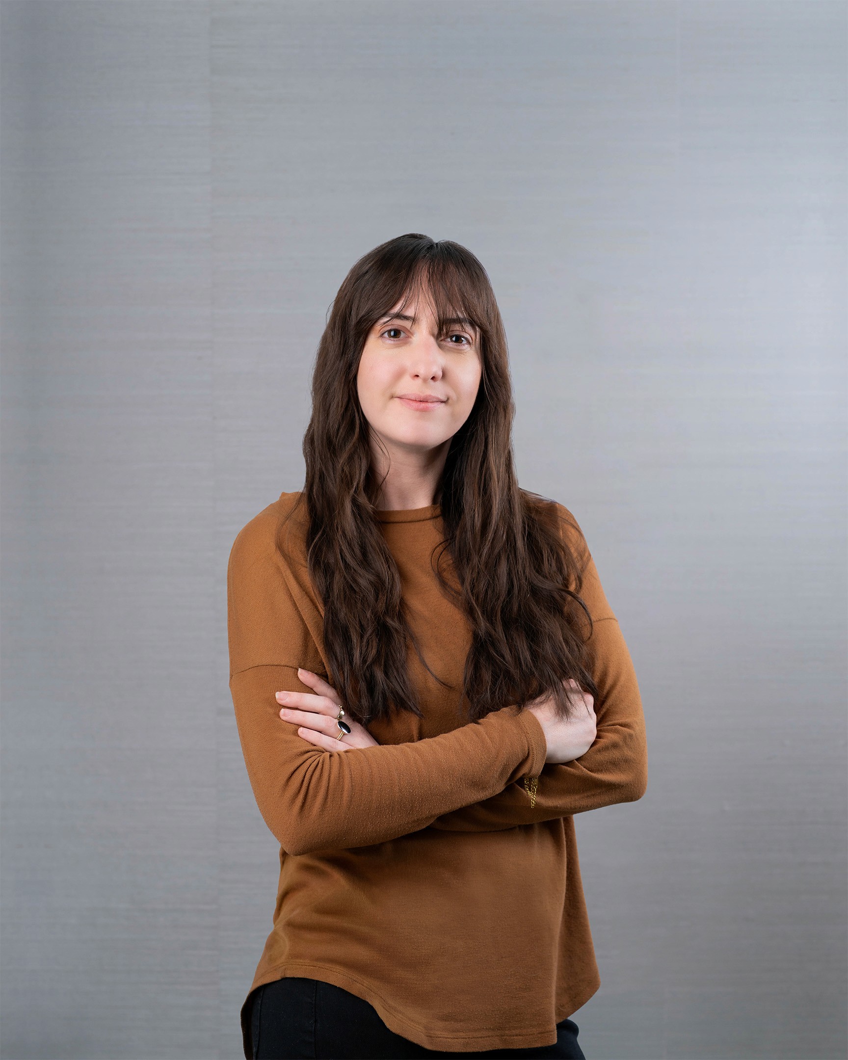 Young woman with long brown hair.