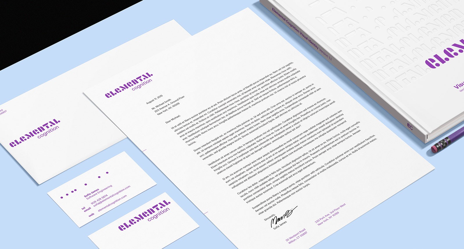 A 3d view of some calling cards and apiece of paper, each having the same purple logo: ELEMENTAL and some text on them.