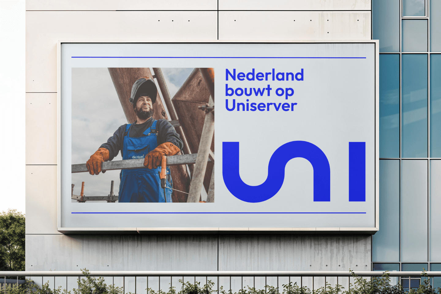 Streetside billboard with flyposters of the Batch.Works brand and illustrations