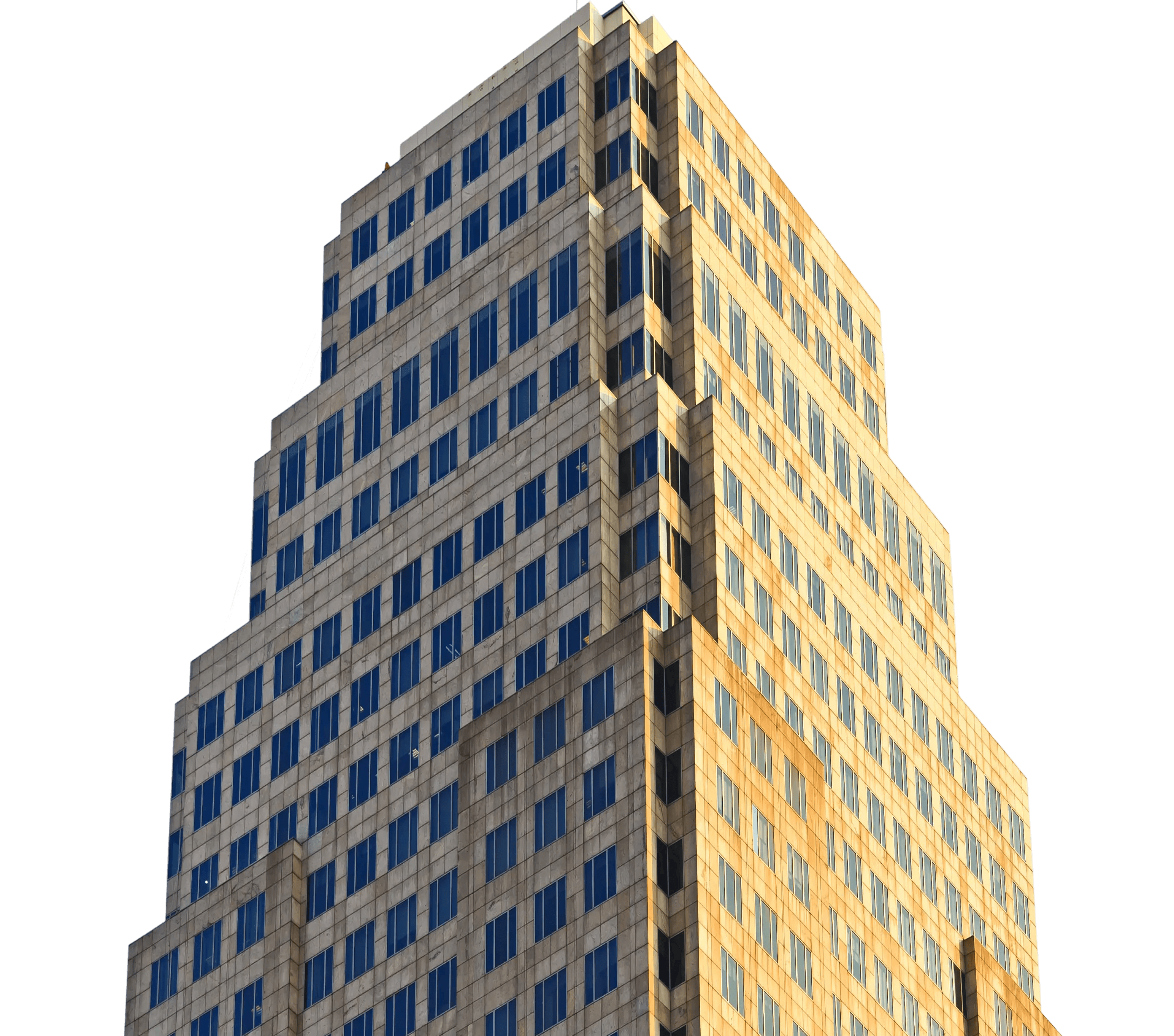 Art Deco-style skyscraper with a tiered architectural design and blue windows illuminated by golden hour sunlight.