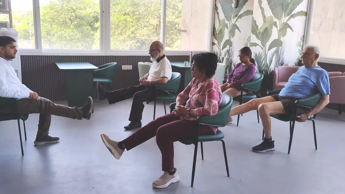 Leg exercises by members at aamra seniors club