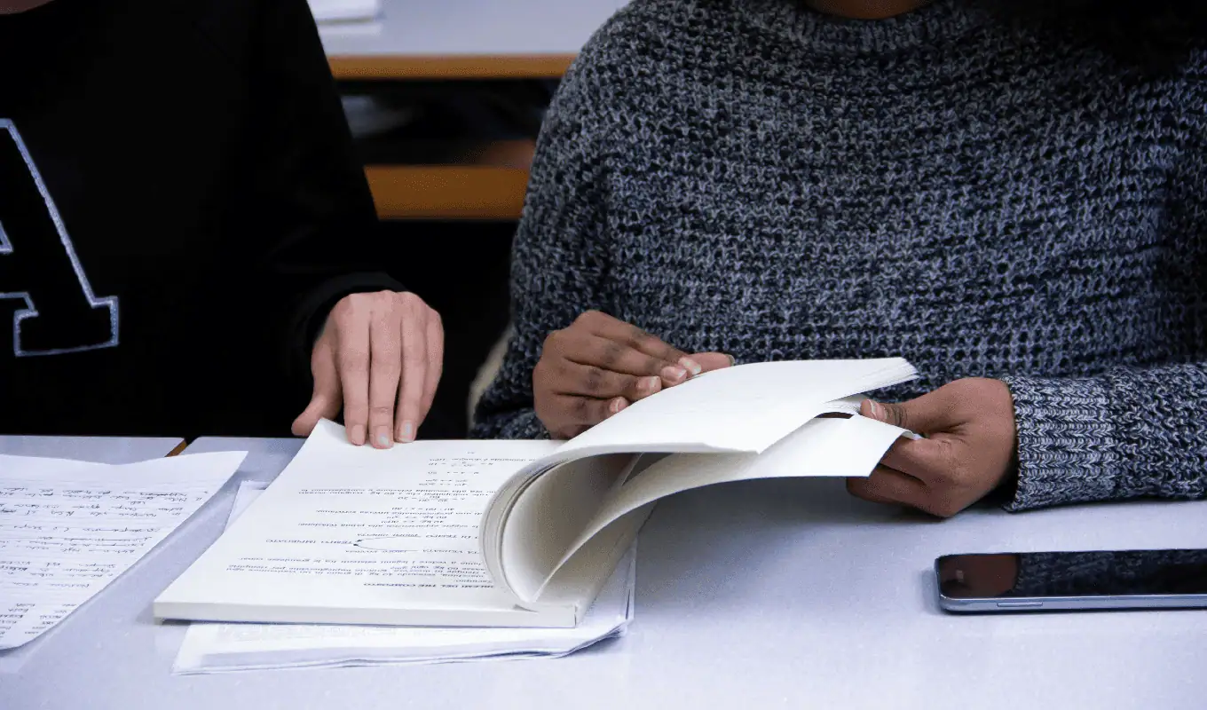 woman flipping book page