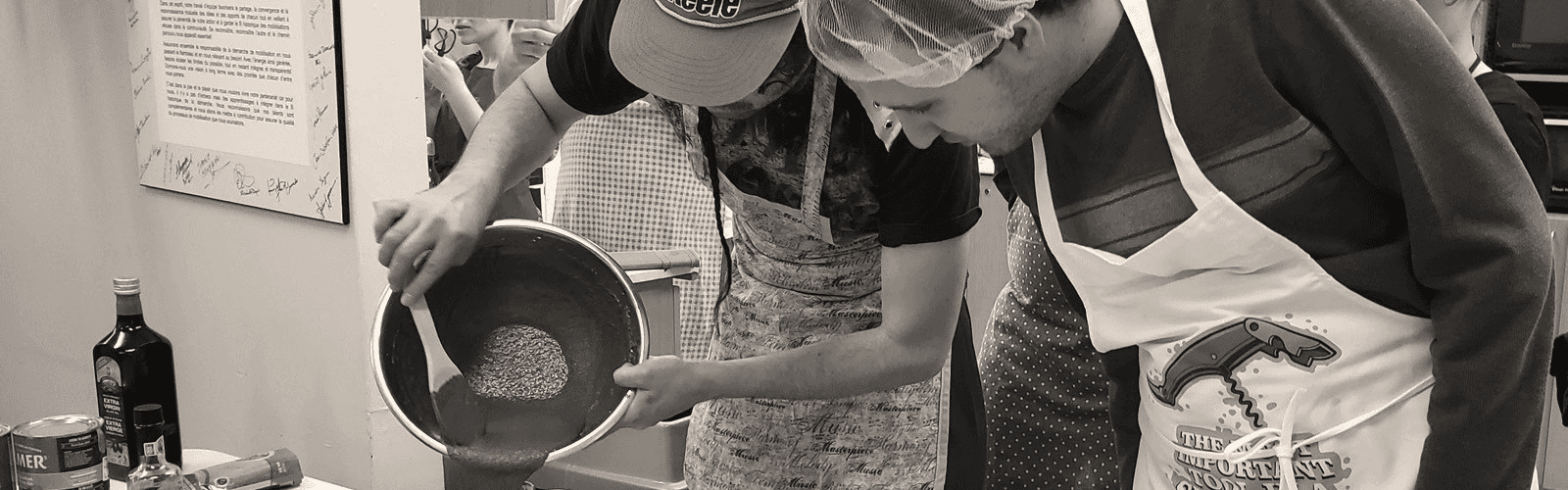 Two person cooking, probably a cake