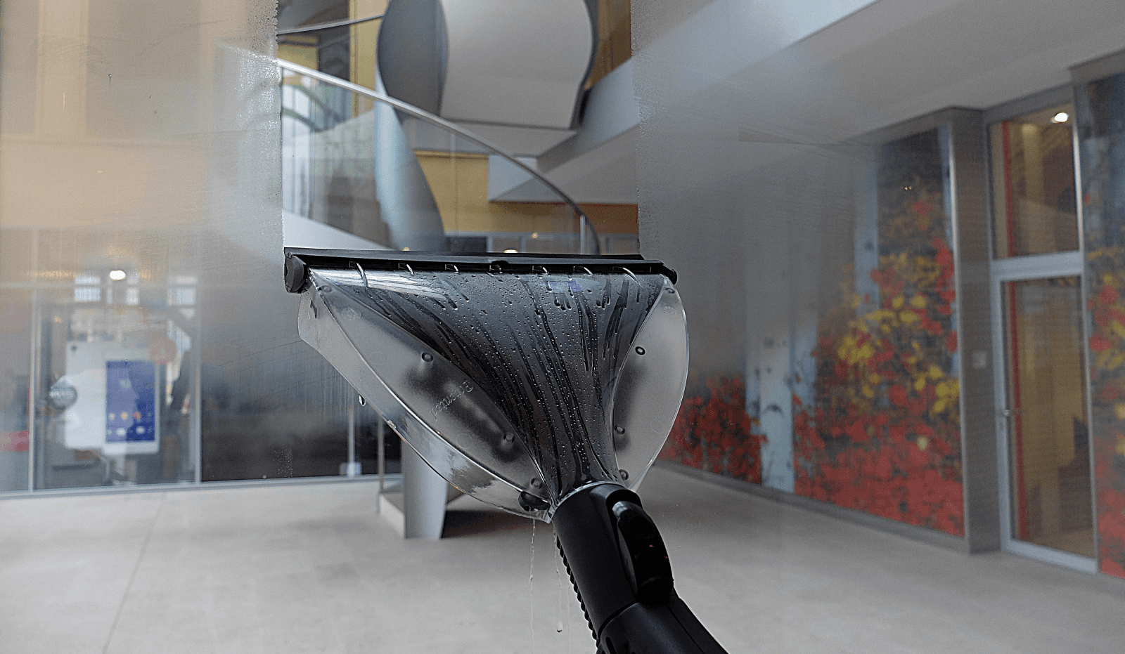 steam cleaning gym glass and mirrors