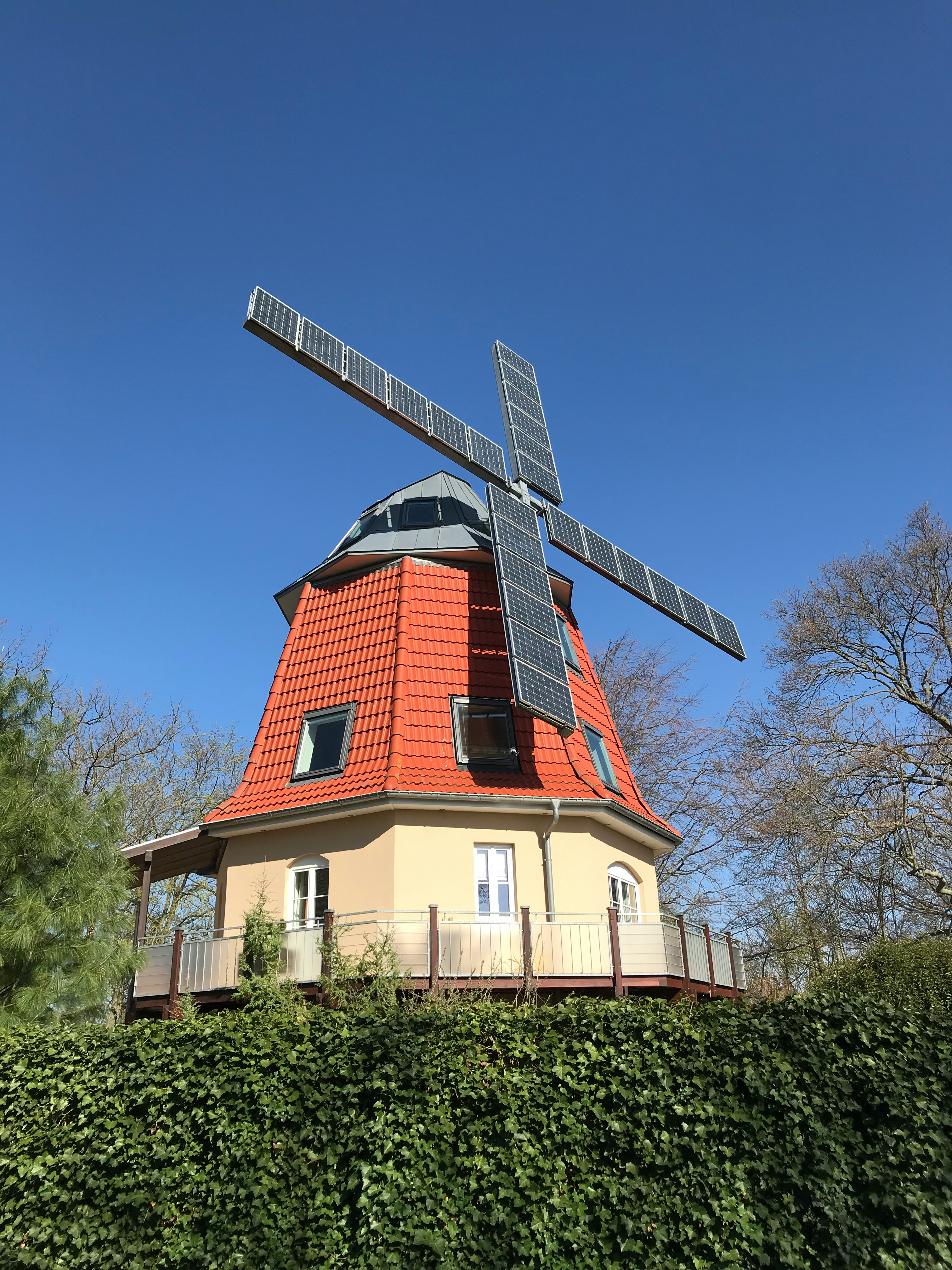 Windmill with solar panels on its blades