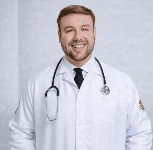 man in white dress shirt wearing black framed eyeglasses