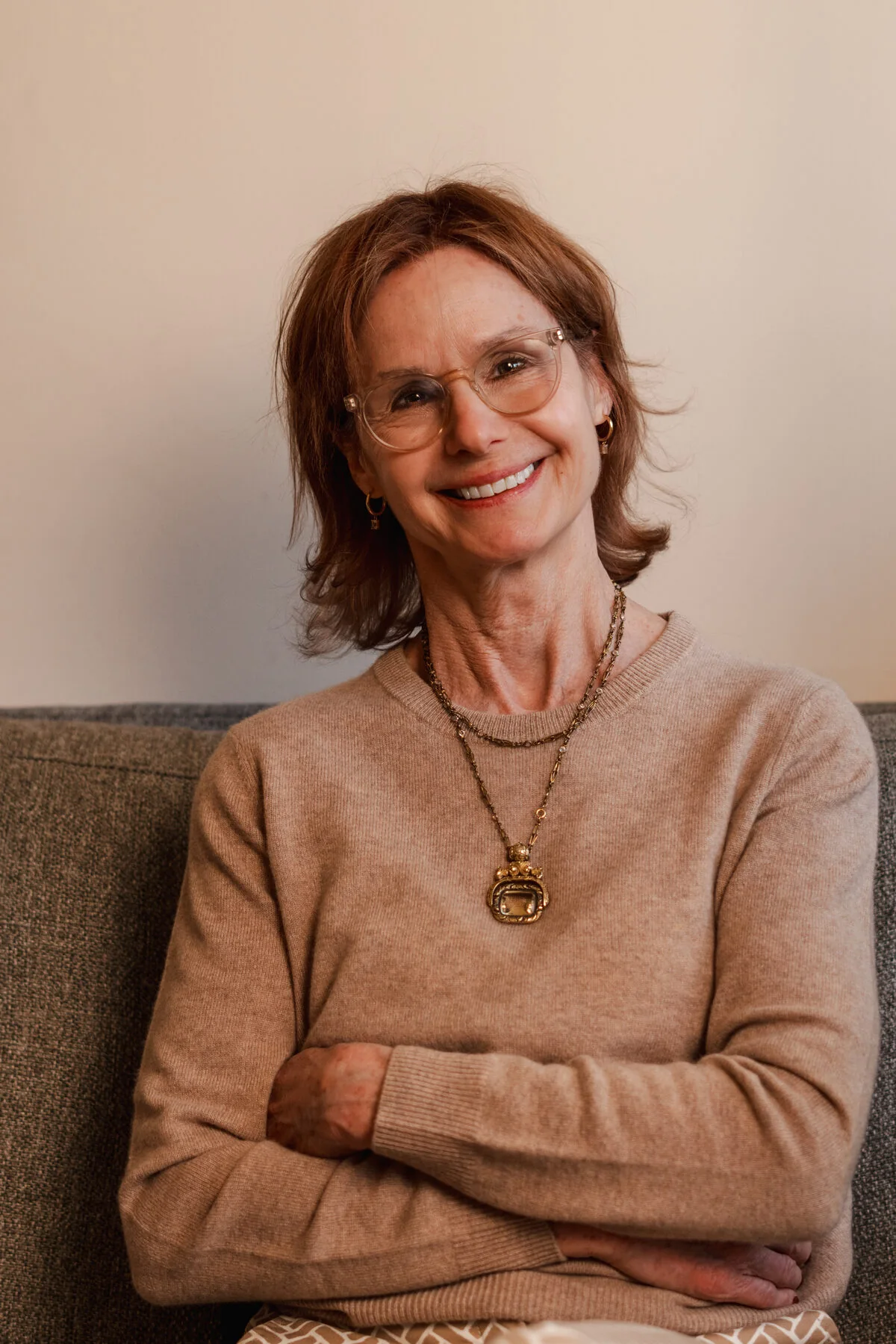 Wendy Cleary smiling with her arms crossed