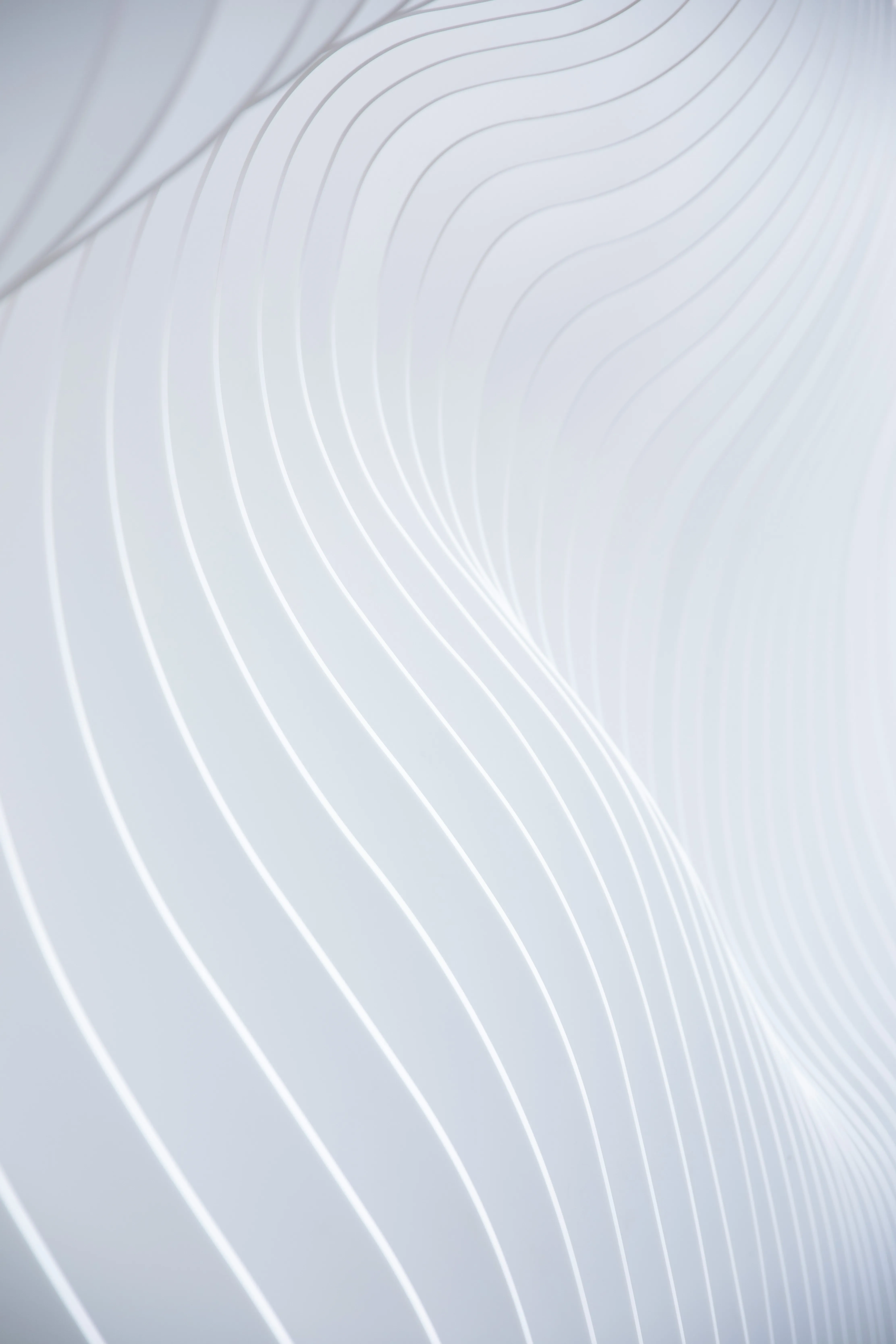 a close up of a white wall with wavy lines