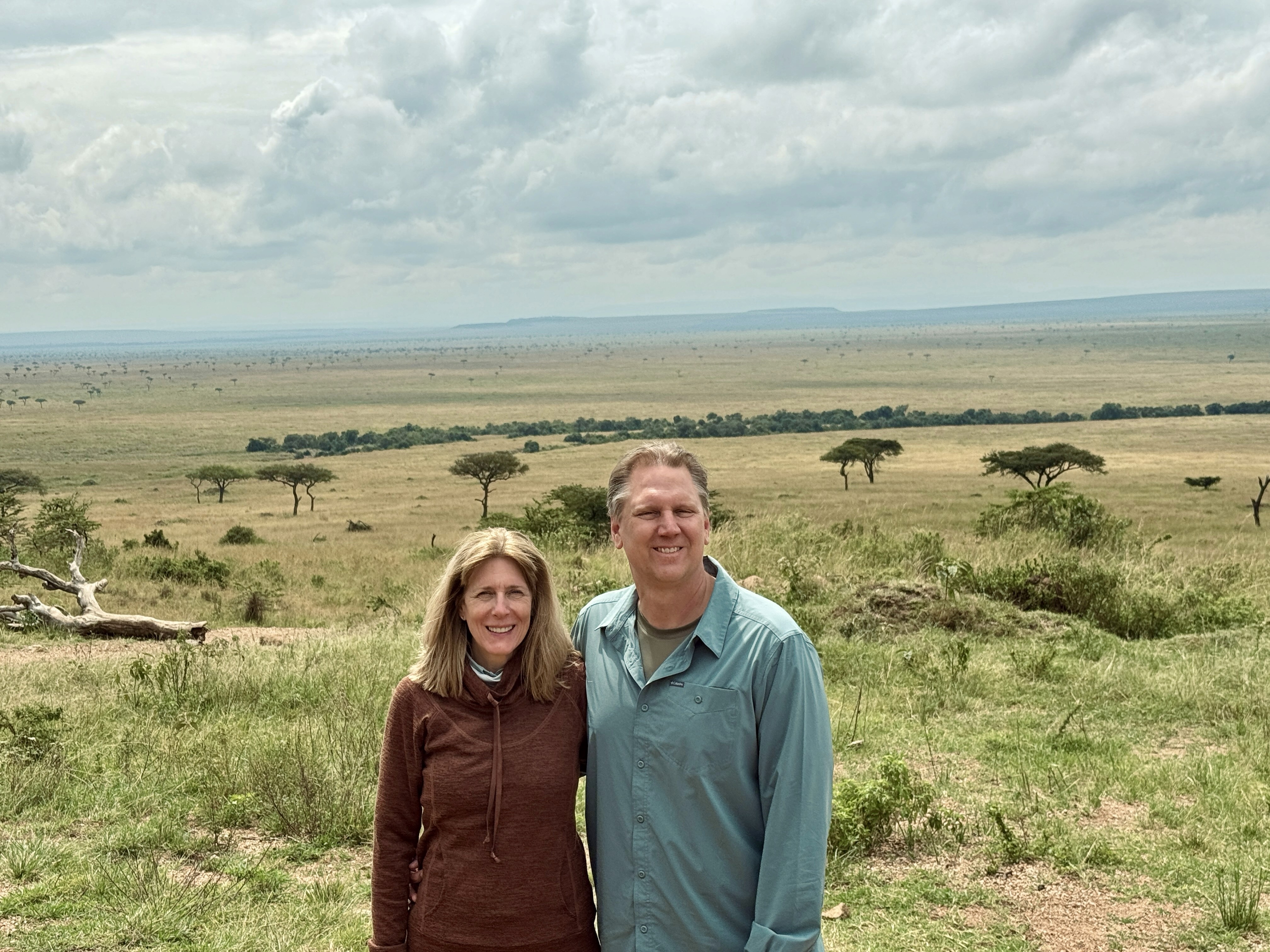 The Toners in front of the sweeping plains of the Masai Mara