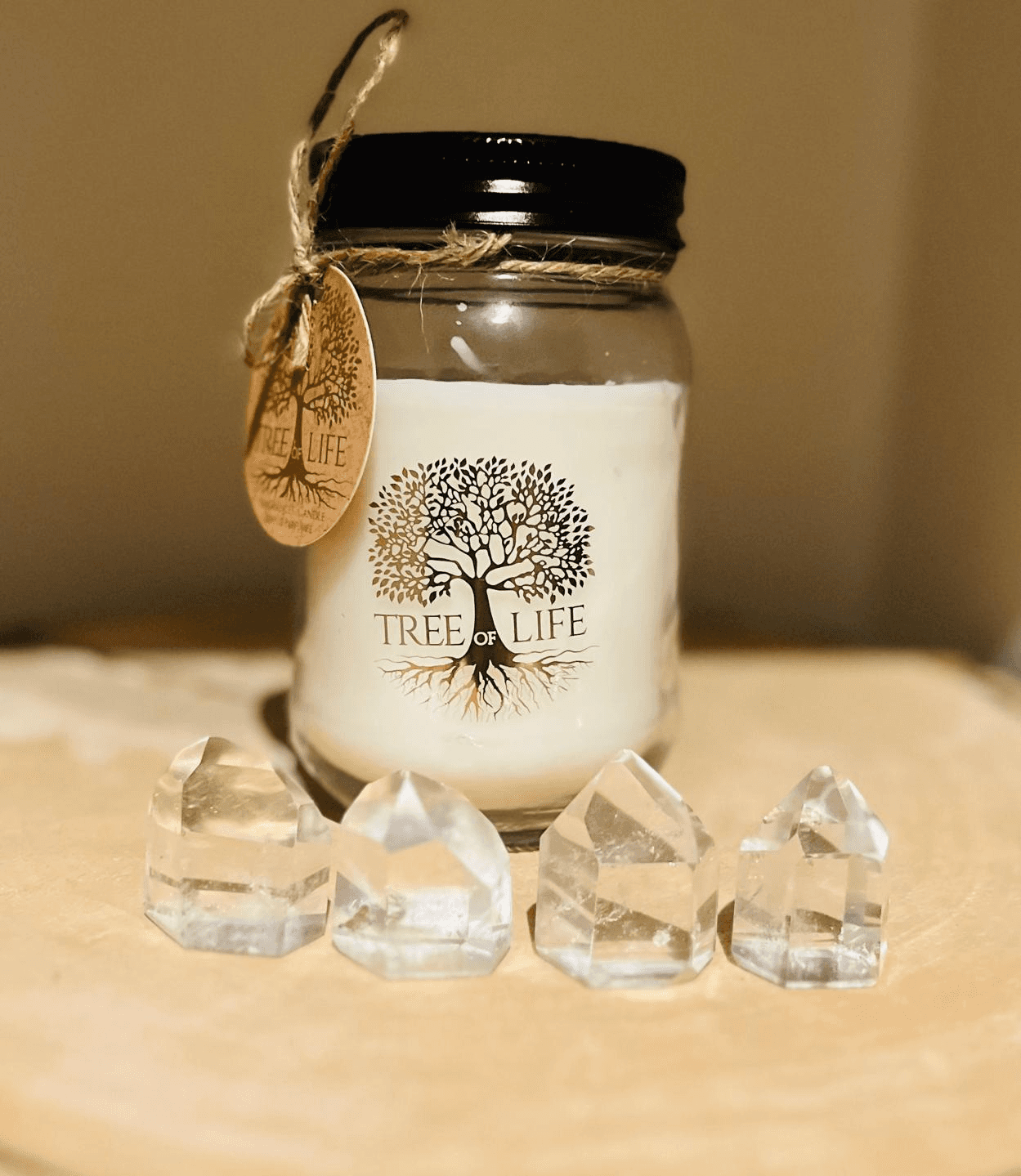 A woman receives a relaxing energy healing in a serene setting with soft lighting.