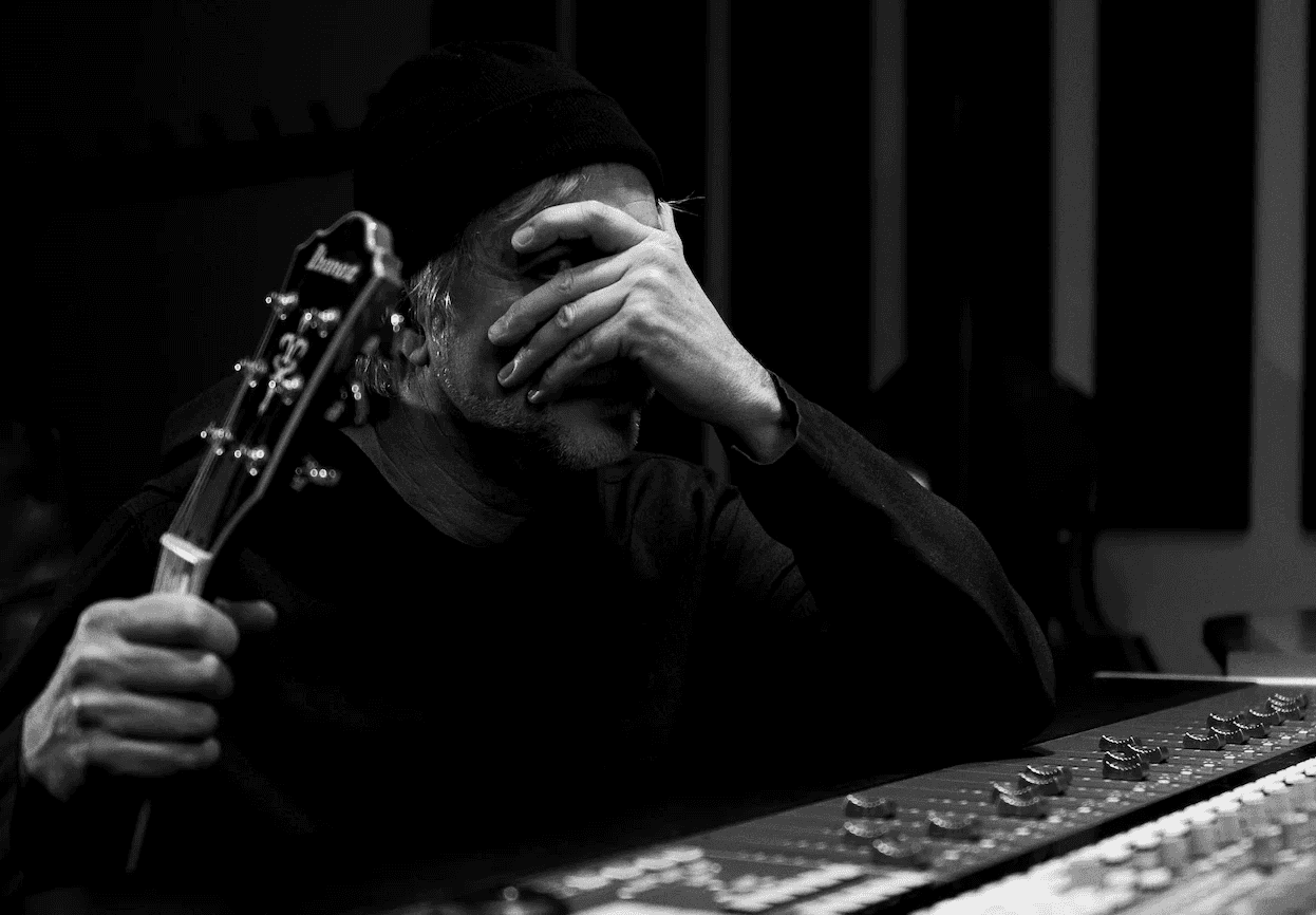 Music producer sitting in his studio