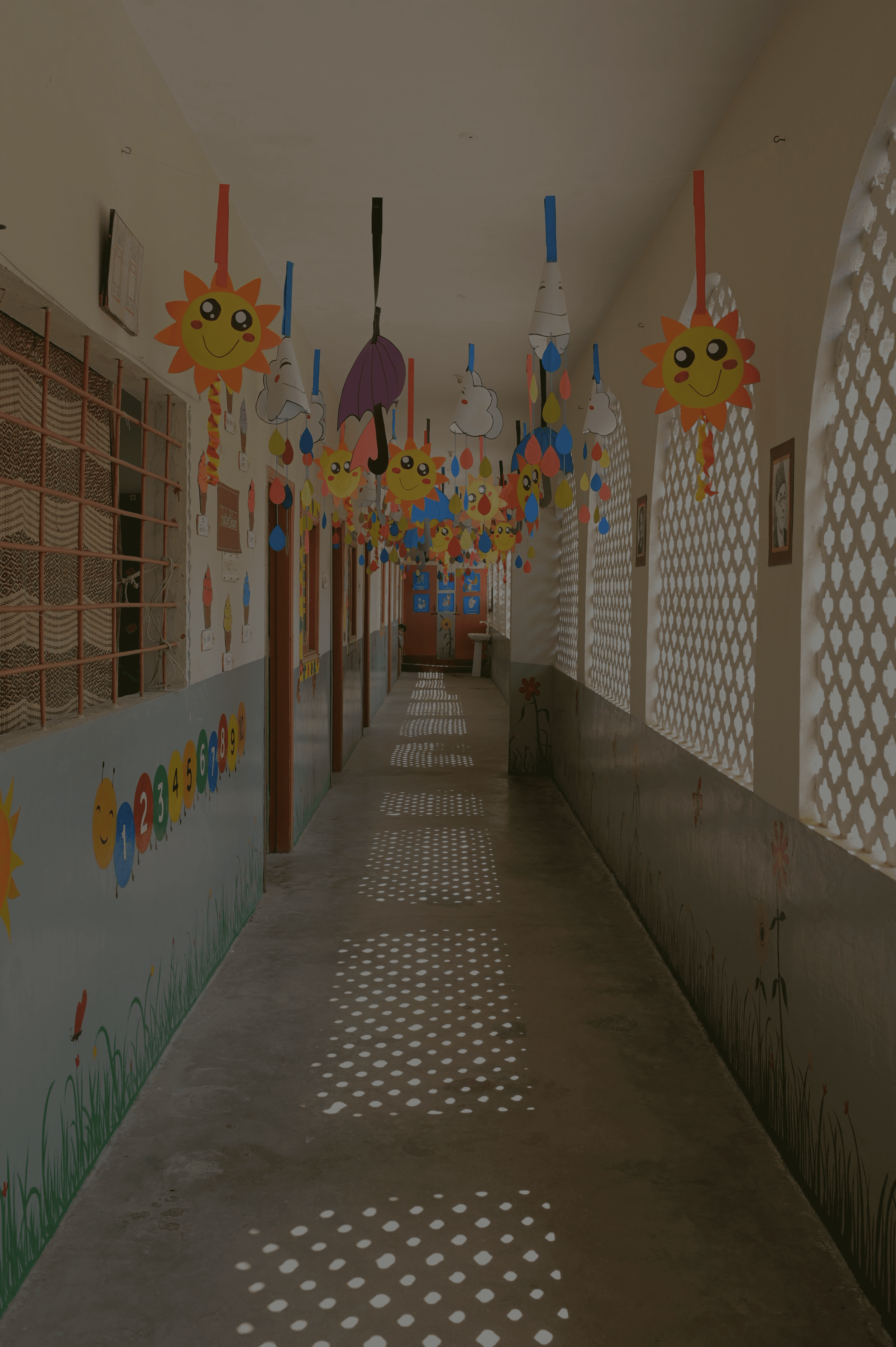 A school campus with buildings, open walkways, and greenery