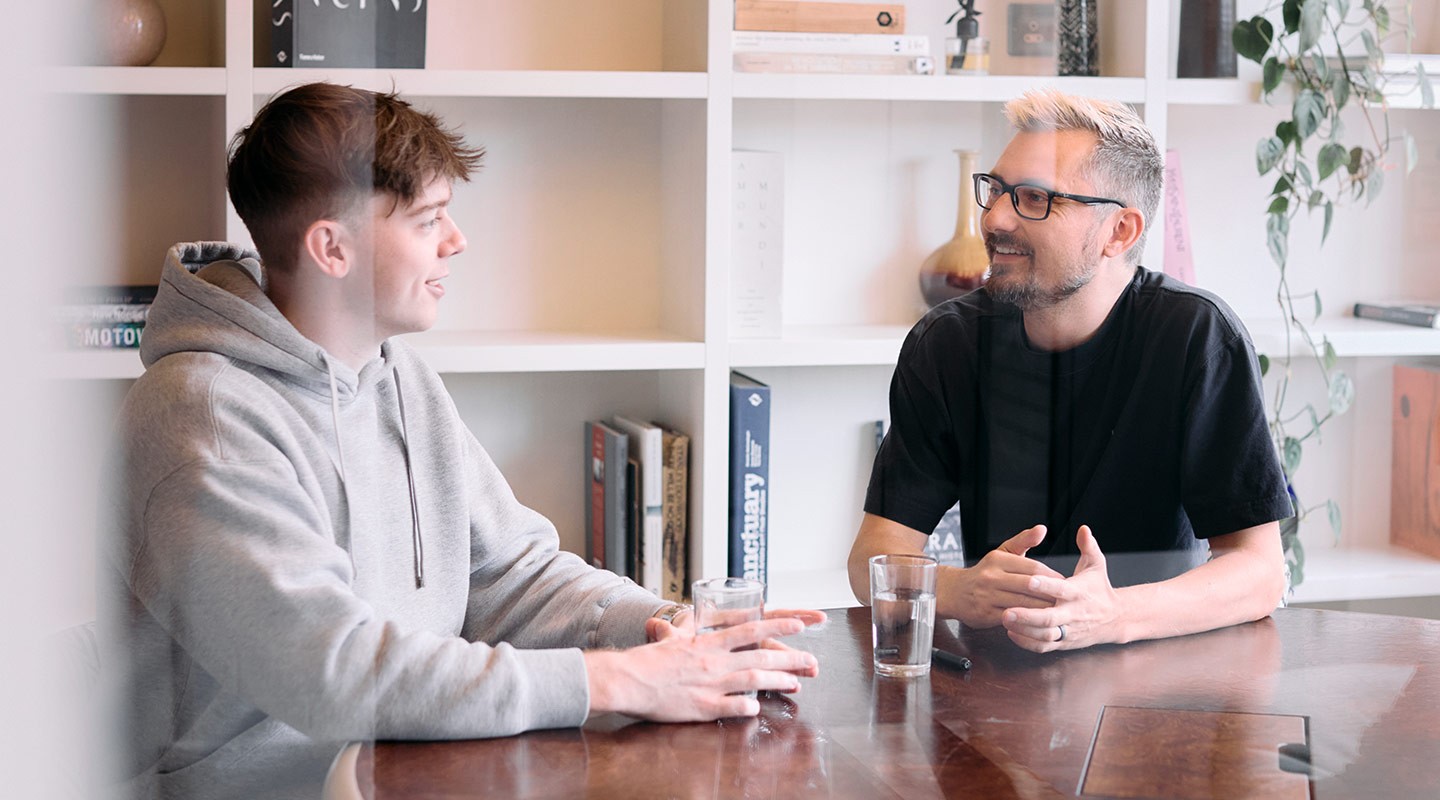 Two members of the Valliance team chatting in a meeting