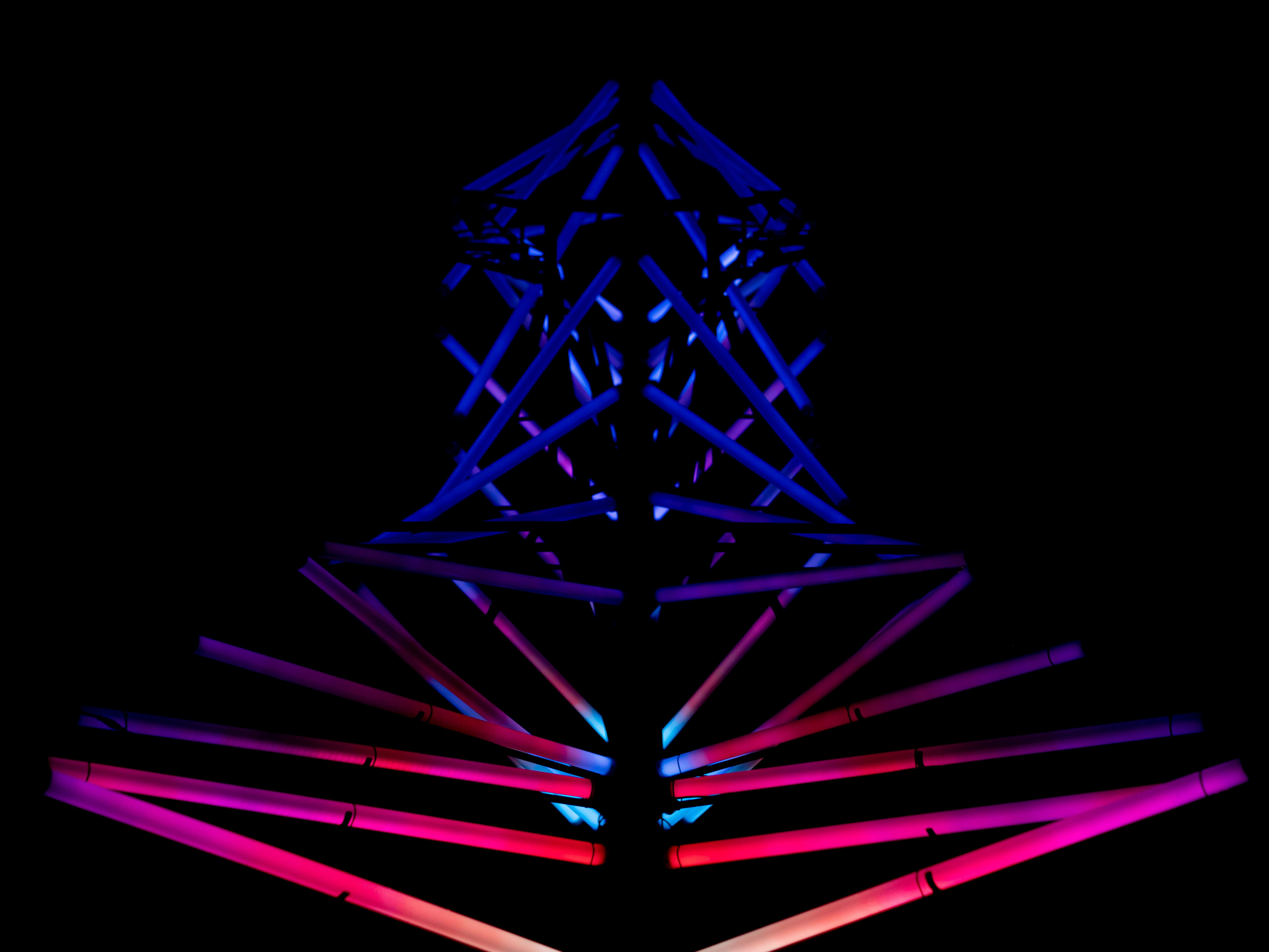 a very tall tower with a clock on it's side