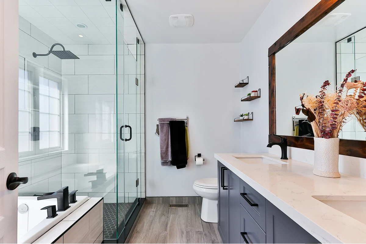 Private bathroom with a glass shower and vanity.