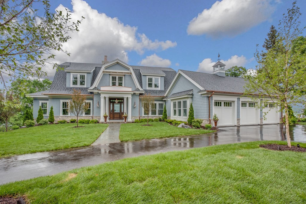 Luxury home exterior with blue siding.