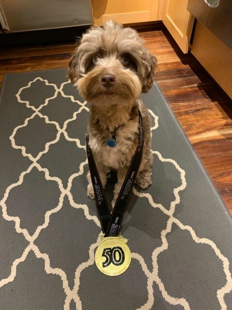  Max showing off my extra-large Seattle marathon medal. 