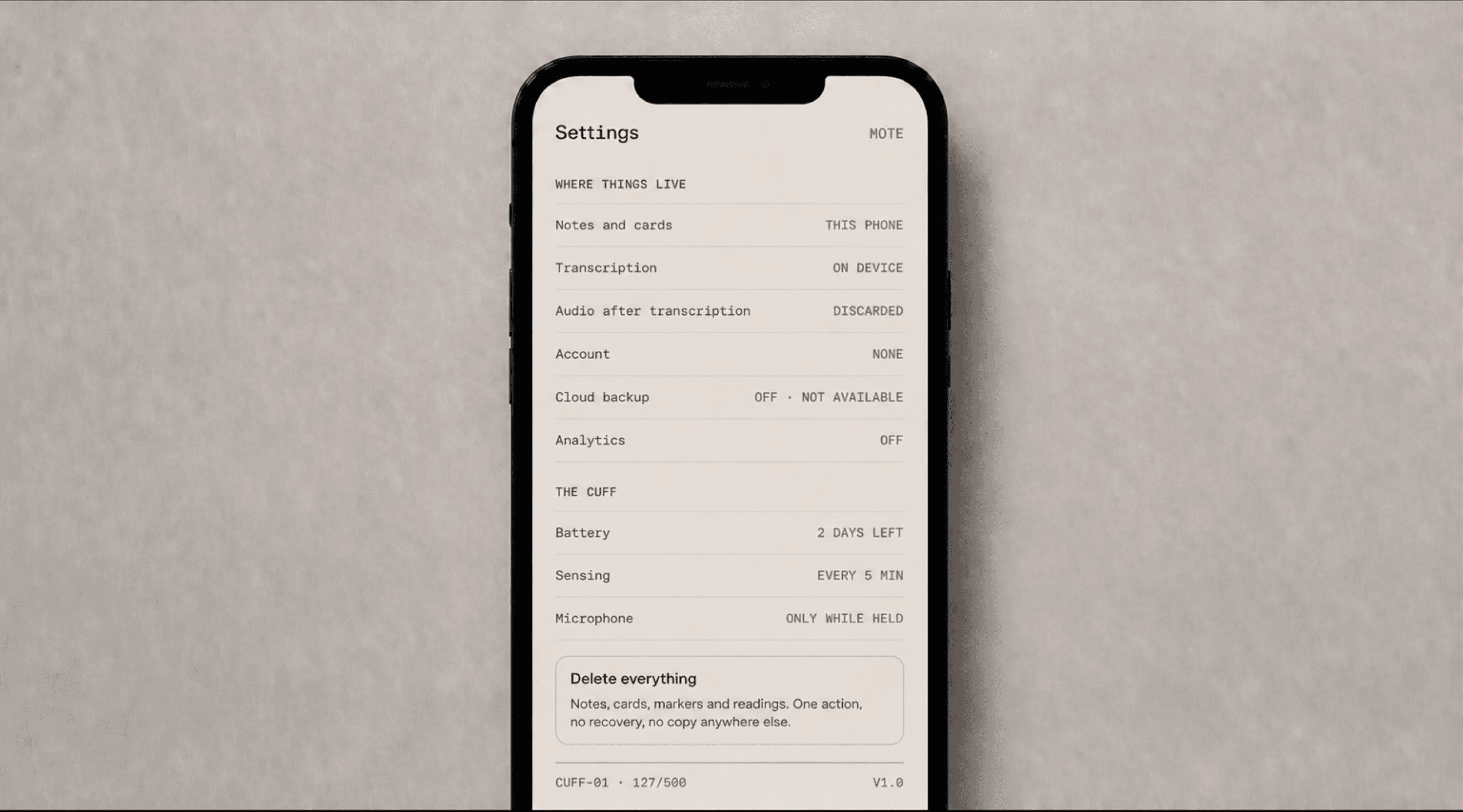 A phone showing Mote settings, with notes and cards kept on the device