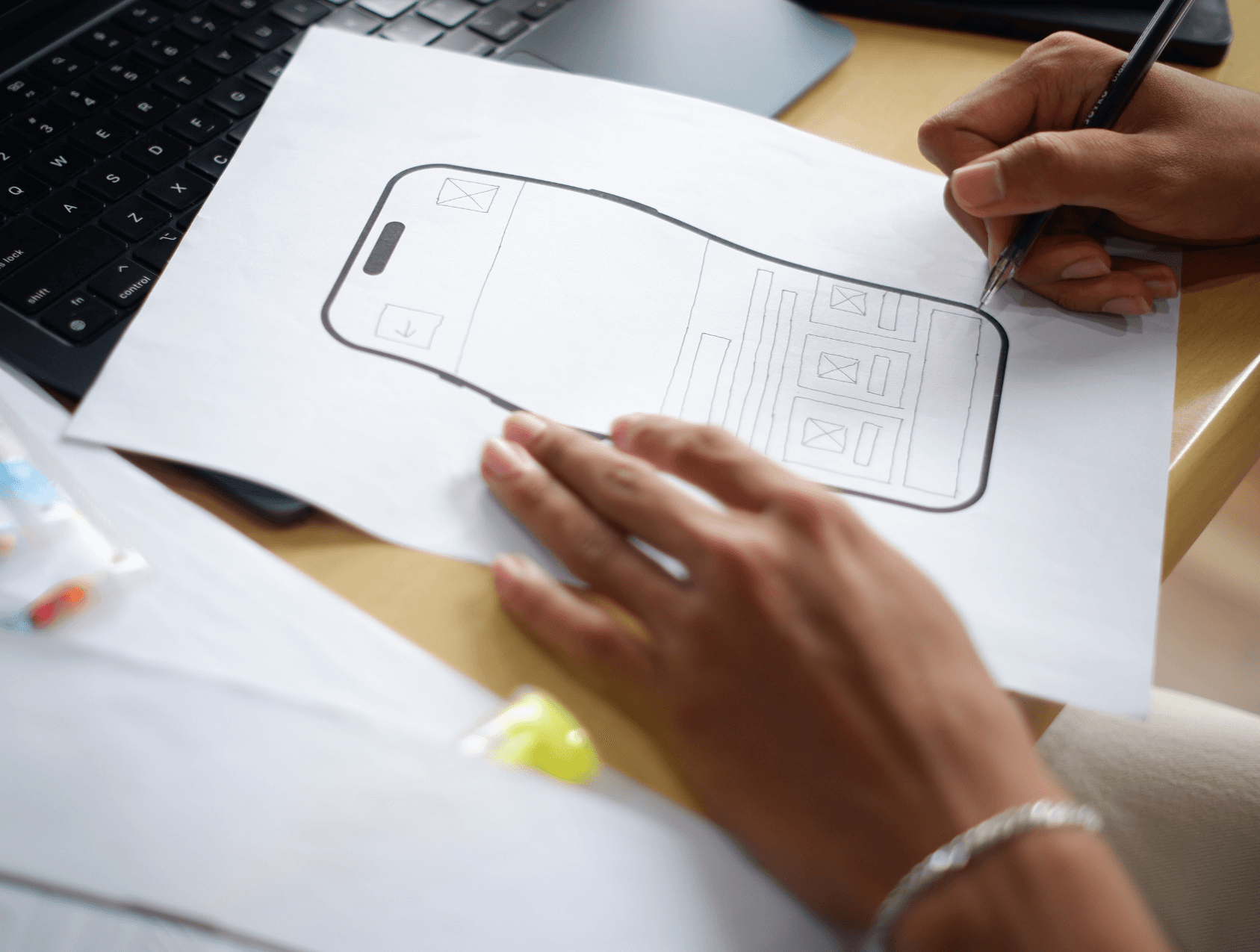 Image of a hand drawing a diagram