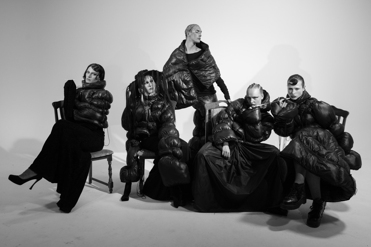 six models sitting together