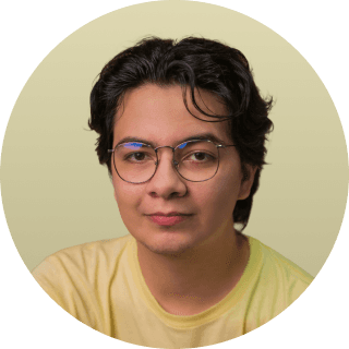 woman in white crew neck shirt smiling