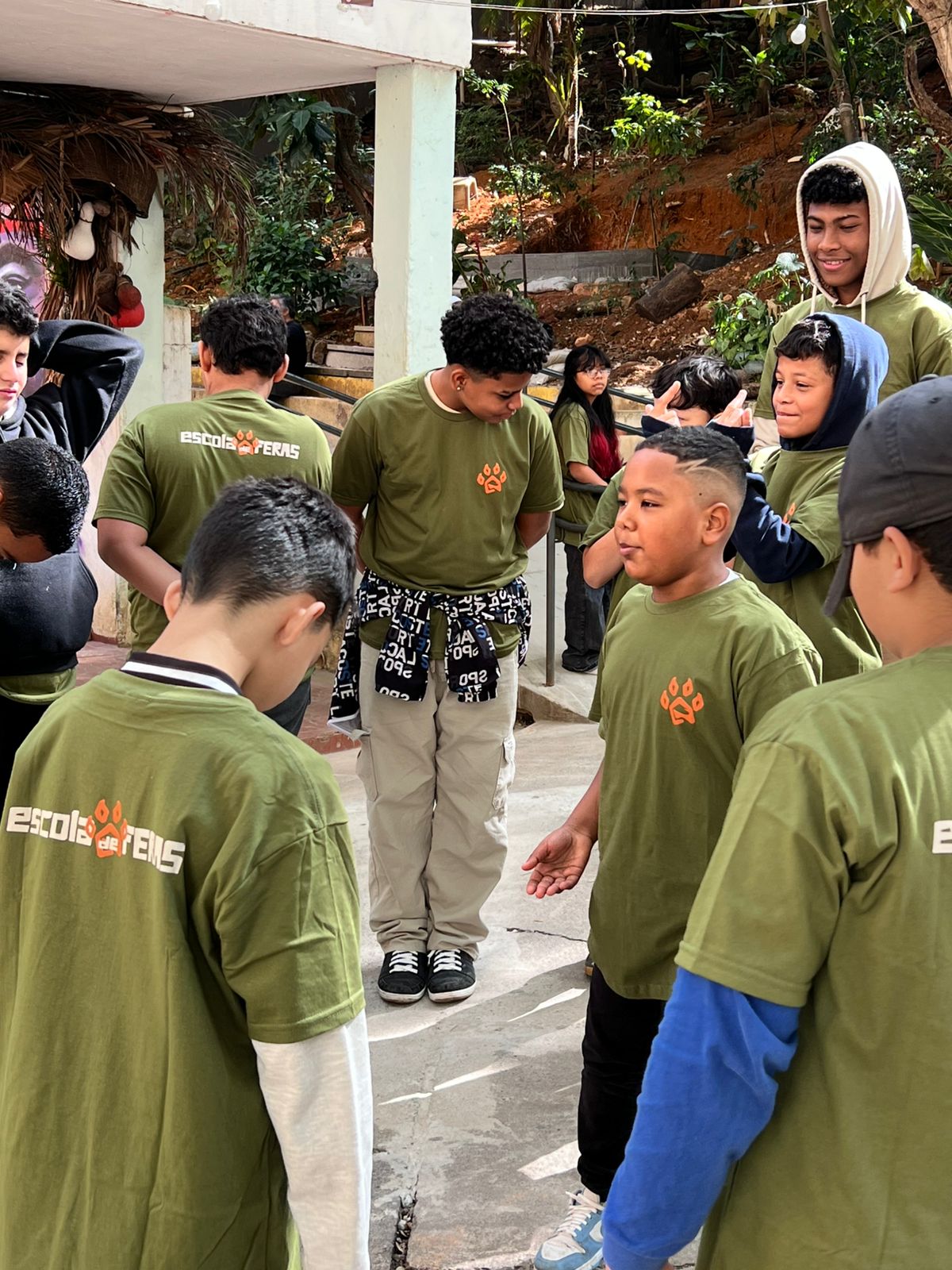 man wearing gray polo shirt beside dry-erase board