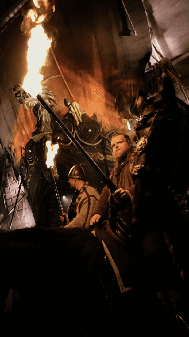 Woman in black outfit sitting on floor