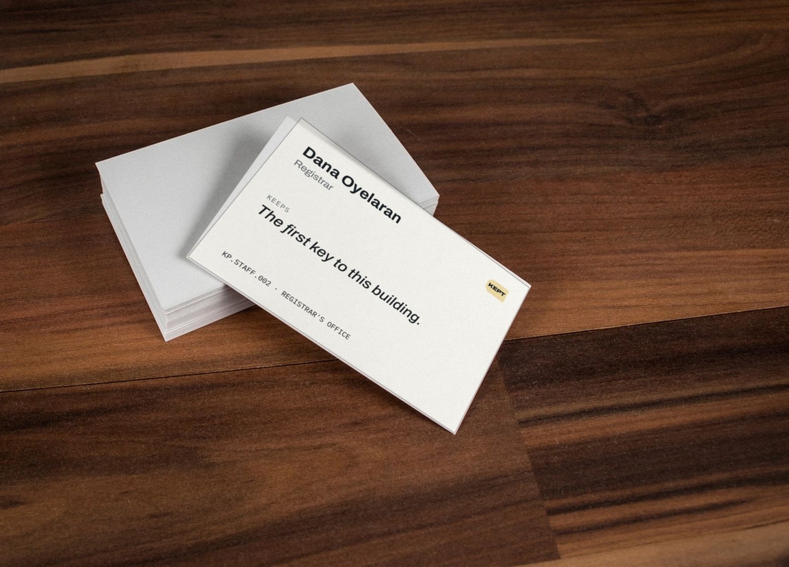 KEPT business card: Dana Oyelaran, Registrar. Keeps: the first key to this building.