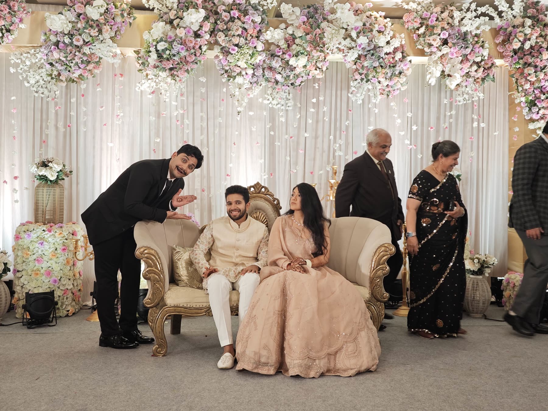 Wedding party portrait near a floral stage