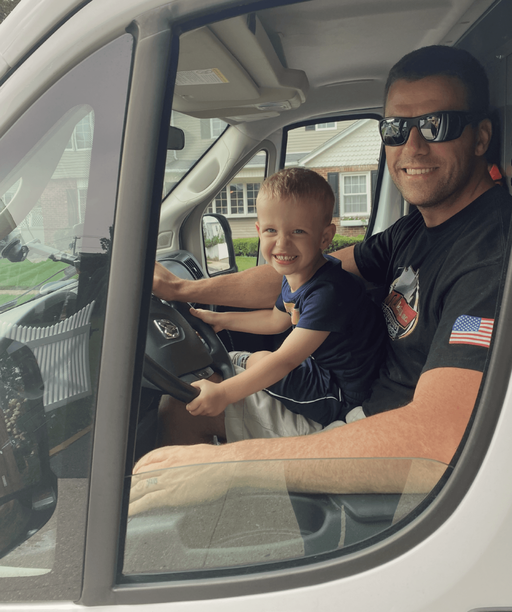 CWM Designs owner and son in work van representing family-owned renovation company