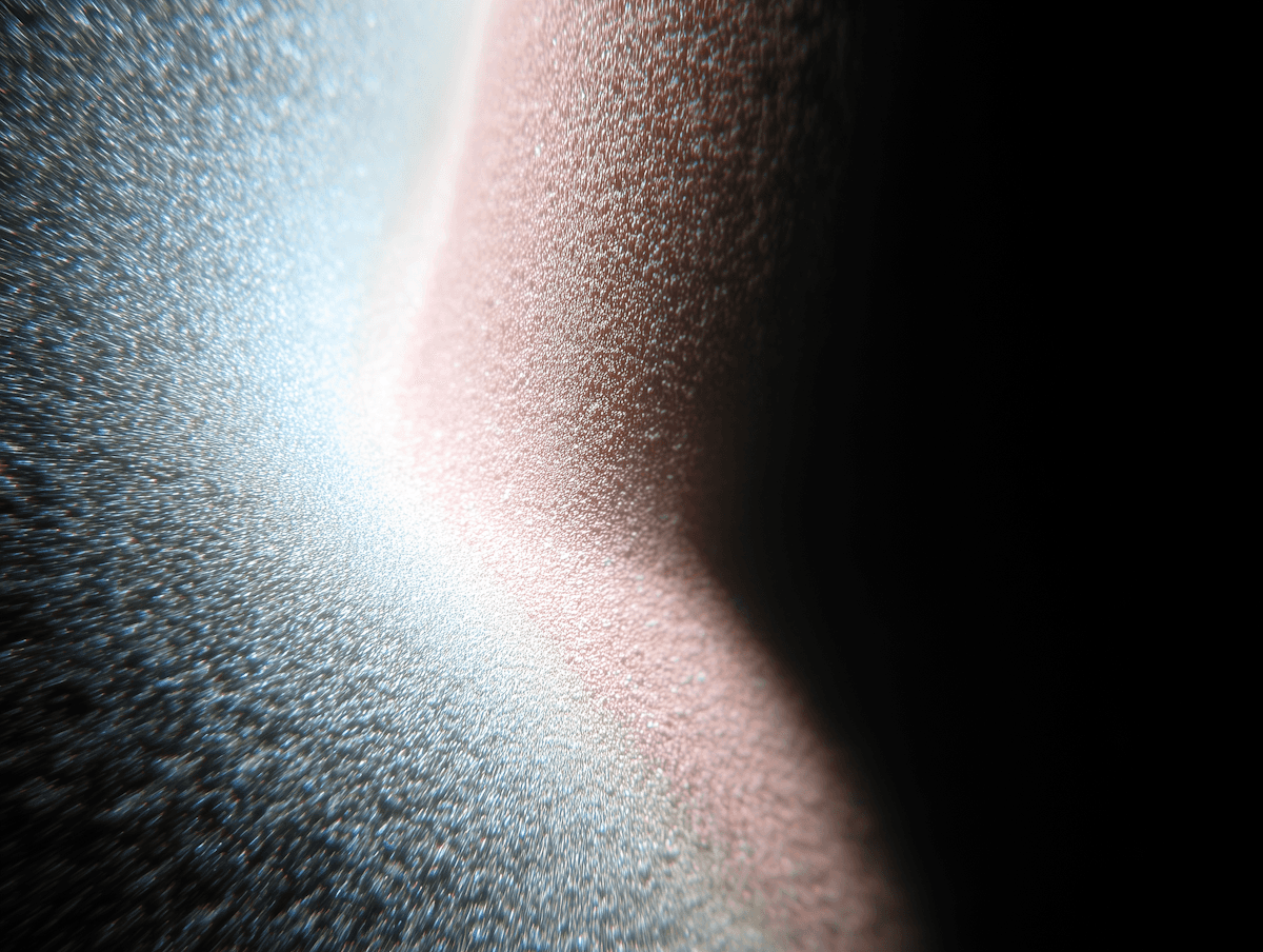 Woman in hat looks at mountains under clear sky