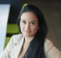 woman in white crew neck shirt smiling