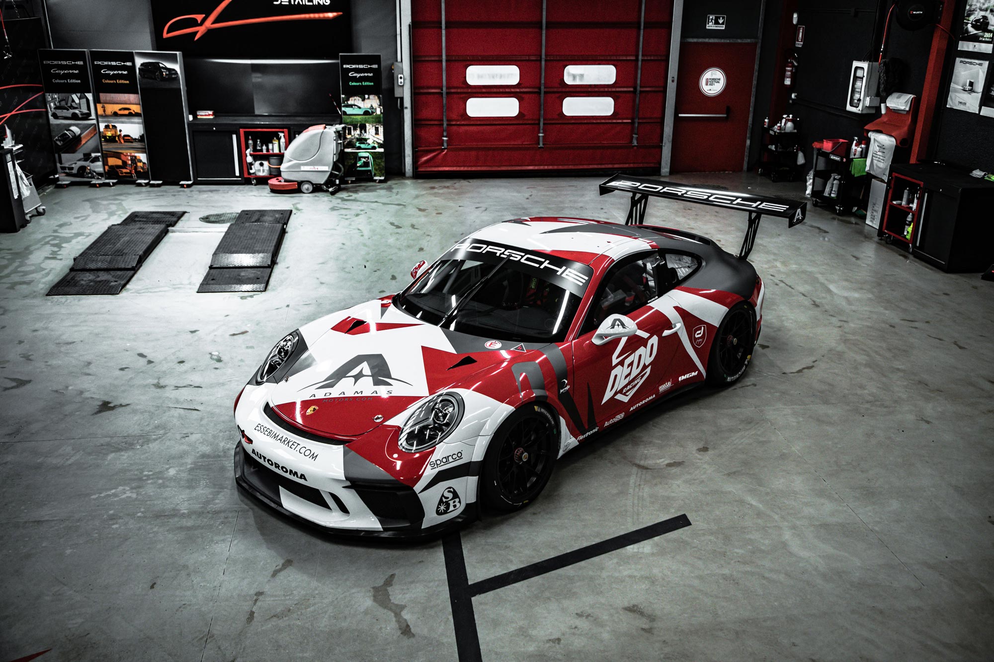 Photo of final racecar with livery in workshop