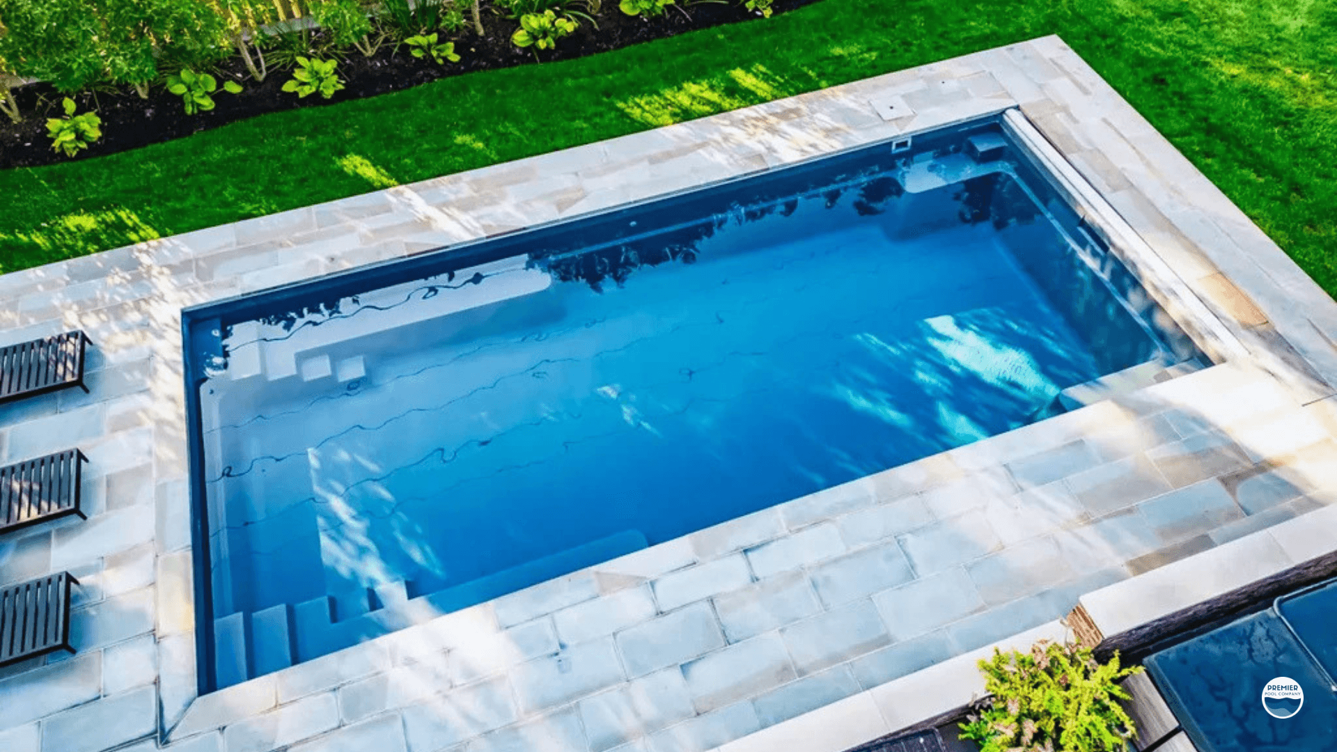 Vinyl liner pool cost example in Ohio backyard with simple decking and landscaping