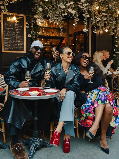 Friends at a Paris cafe with champagne