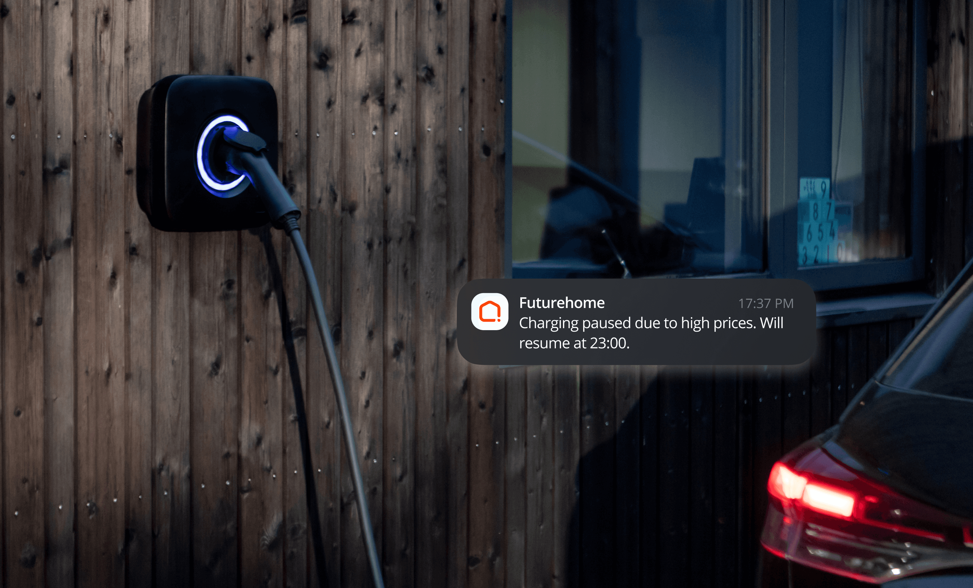 Image of an EV charger with mobile push notification