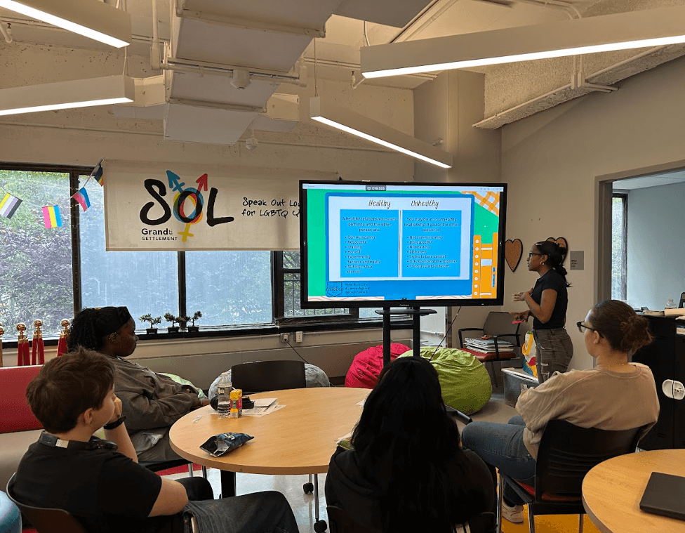 Teens listen to a presentation on  healthy relationship dynamics.