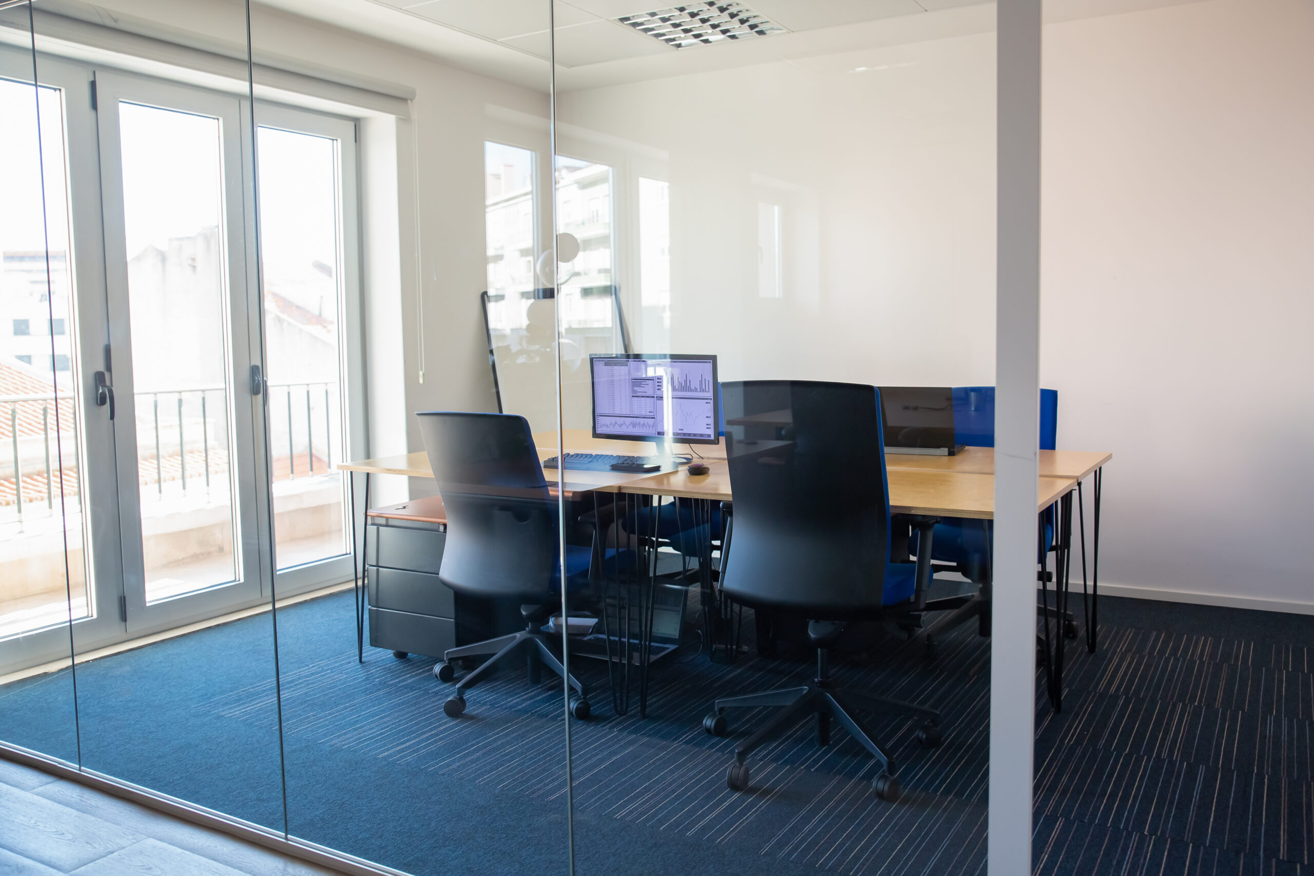 A picture showing a closed office layout with private workspaces and individual desks for focused work.