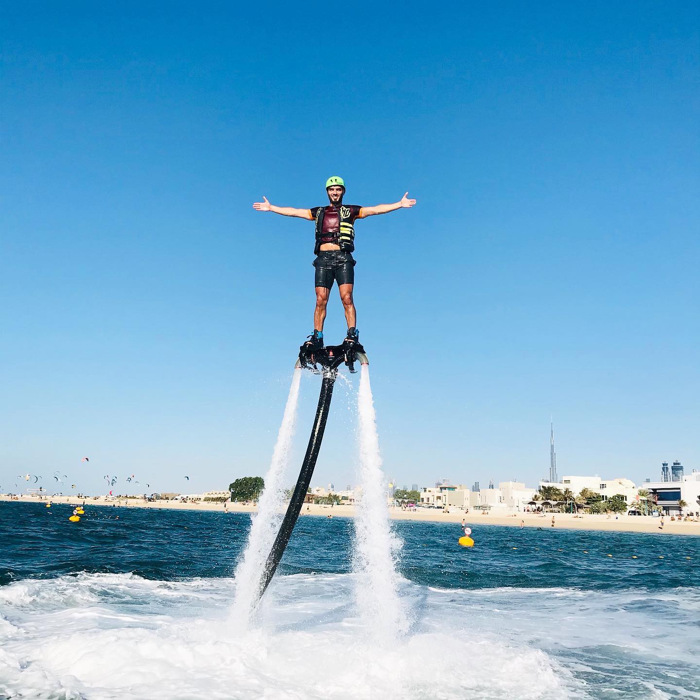 Man enjoying flyboarding in Dubai with skyline views, part of the thrilling flyboarding water adventure experience.