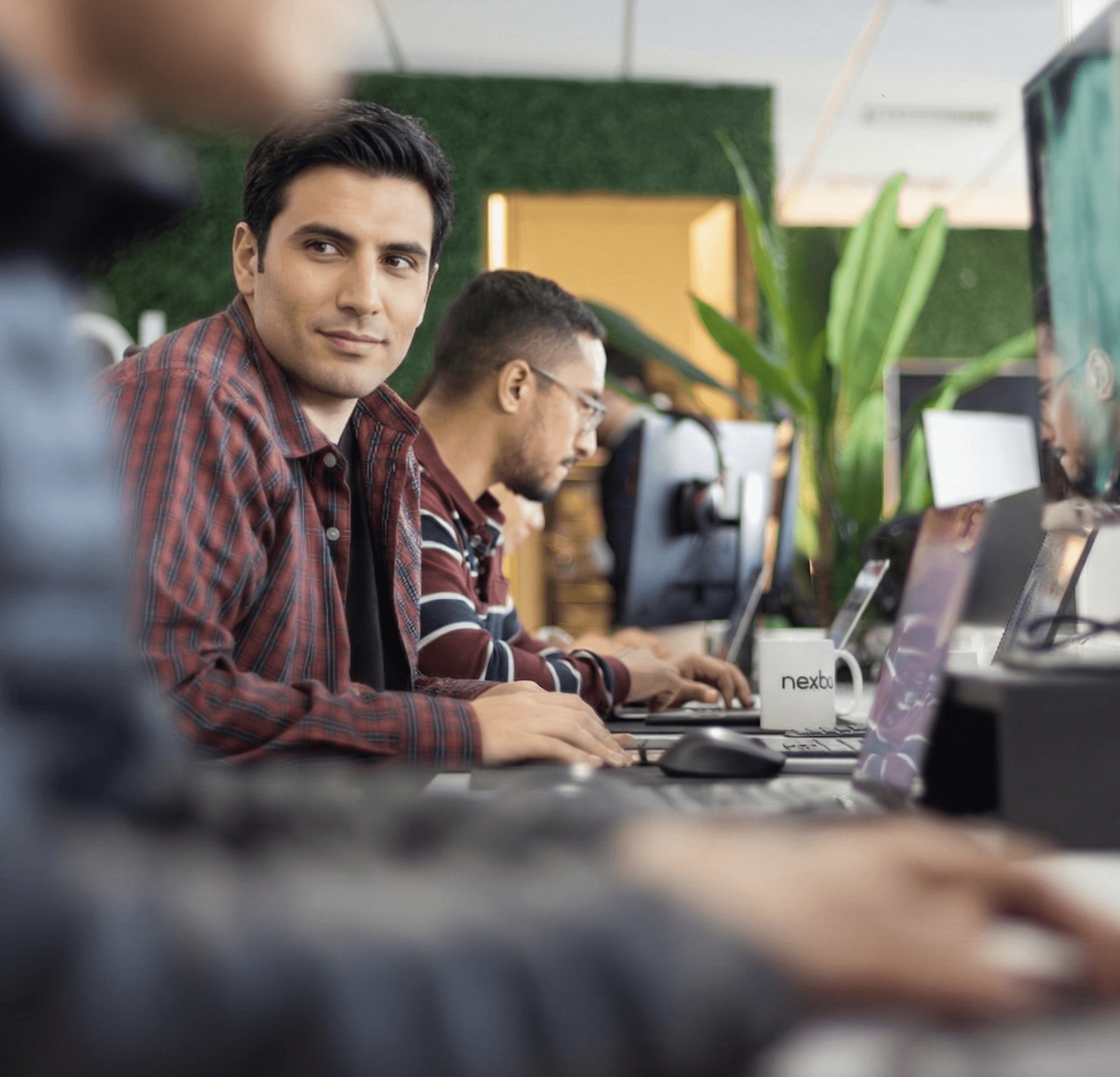 Woman holding a smartphone looking through the glass 