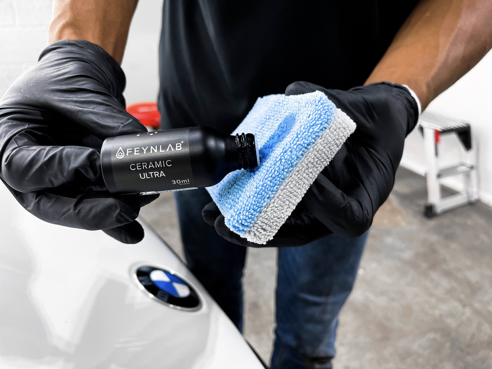 Ceramic coating being applied to a vehicle to add long term paint protection.