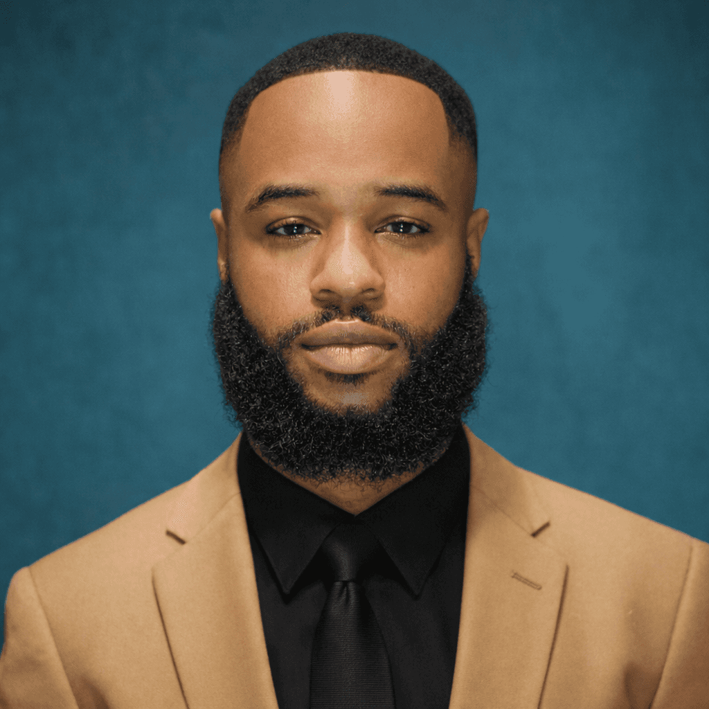 woman in blue tank top standing beside white wall