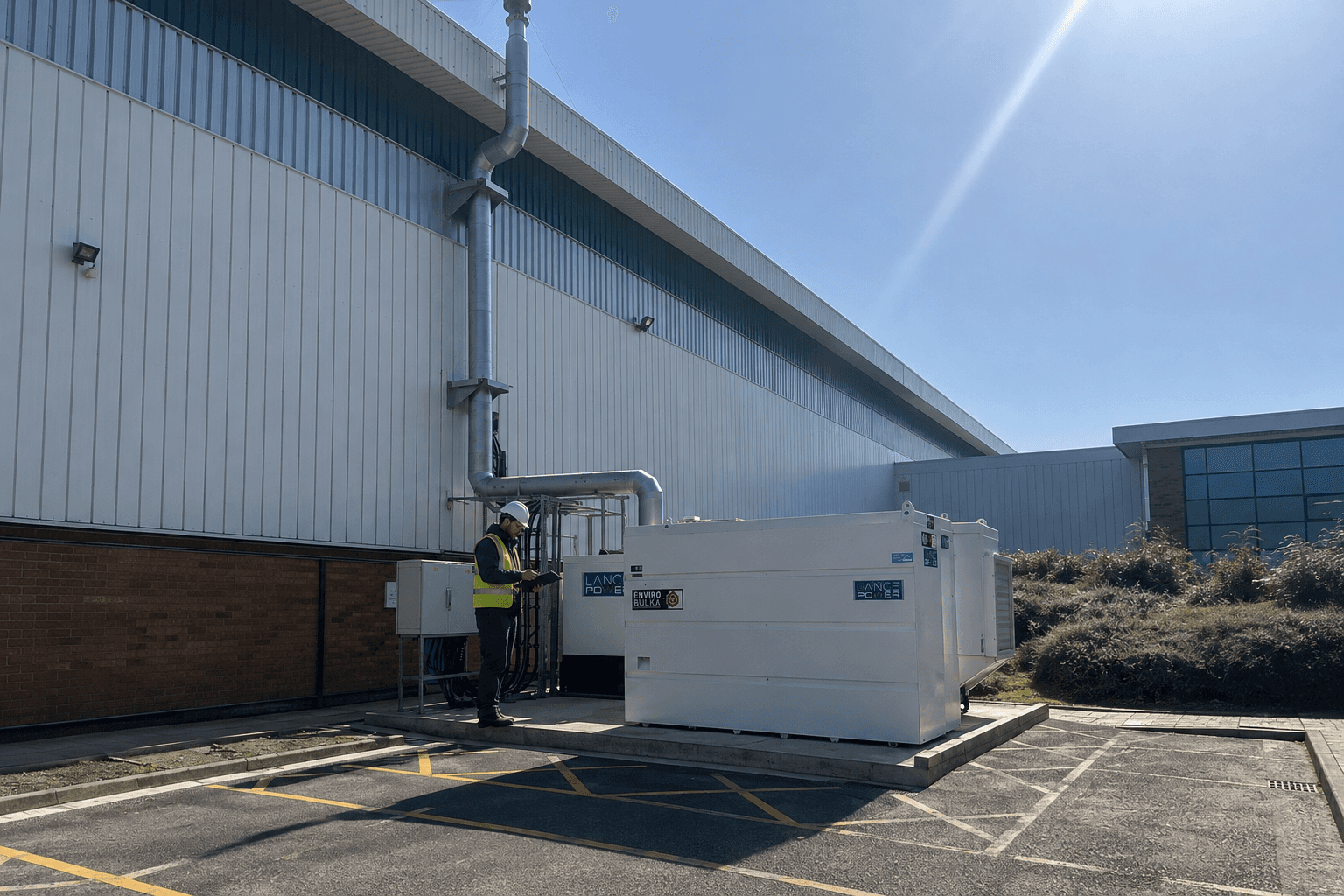 Service engineer inspecting a Lance Power generator at a UK industrial site