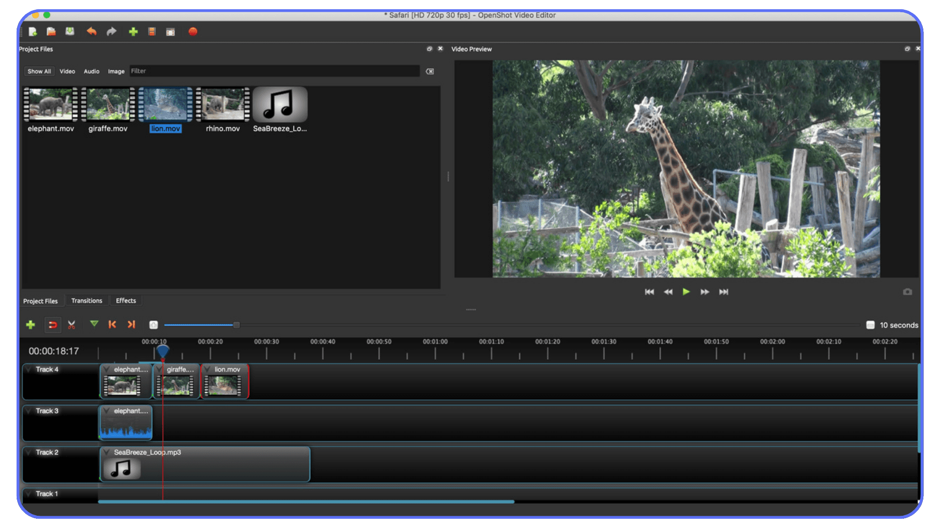 OpenShot video editor featuring a giraffe clip in the preview window, with project files above and a basic timeline showing stacked video and audio tracks.