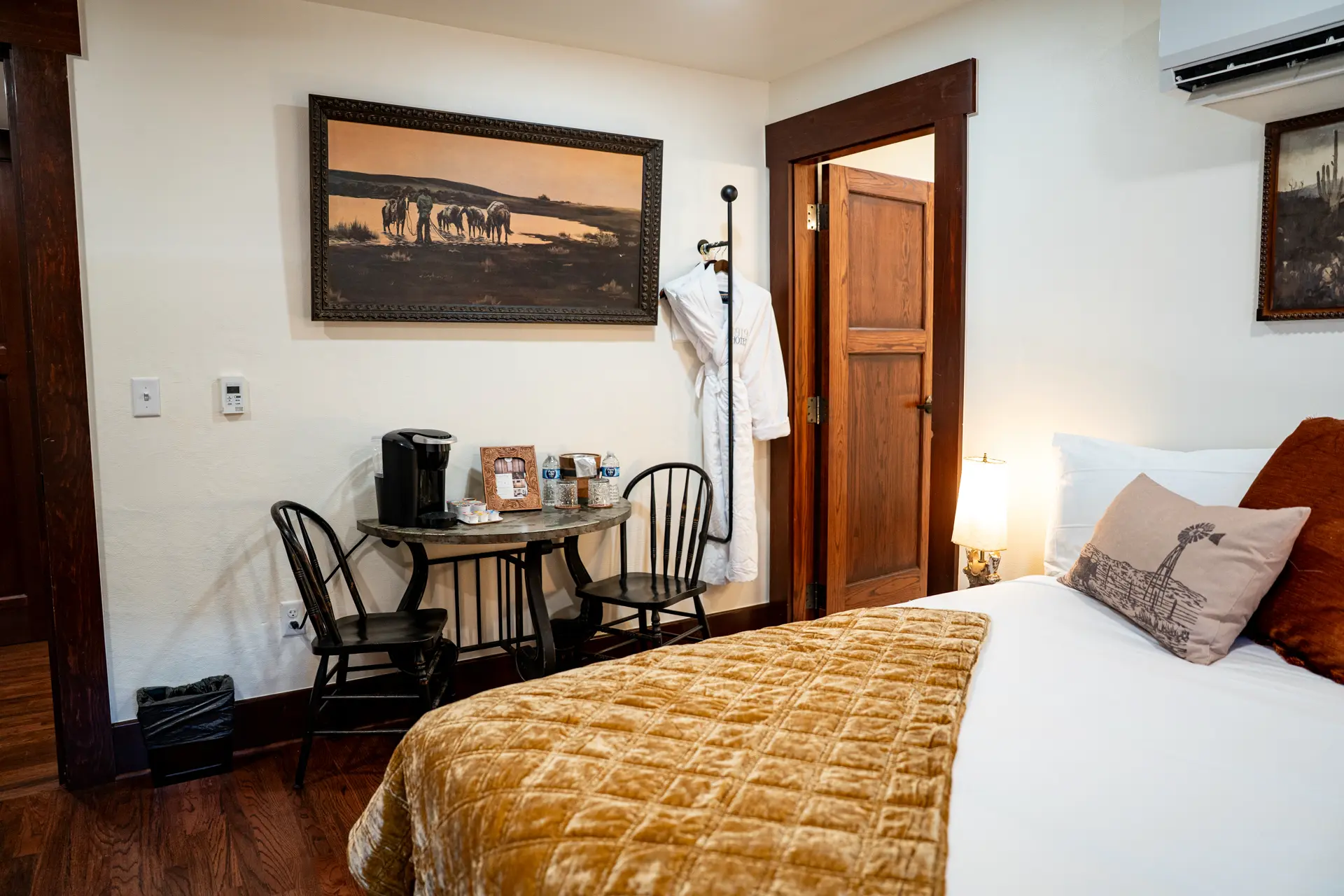 Coffee table, robe and Western artwork