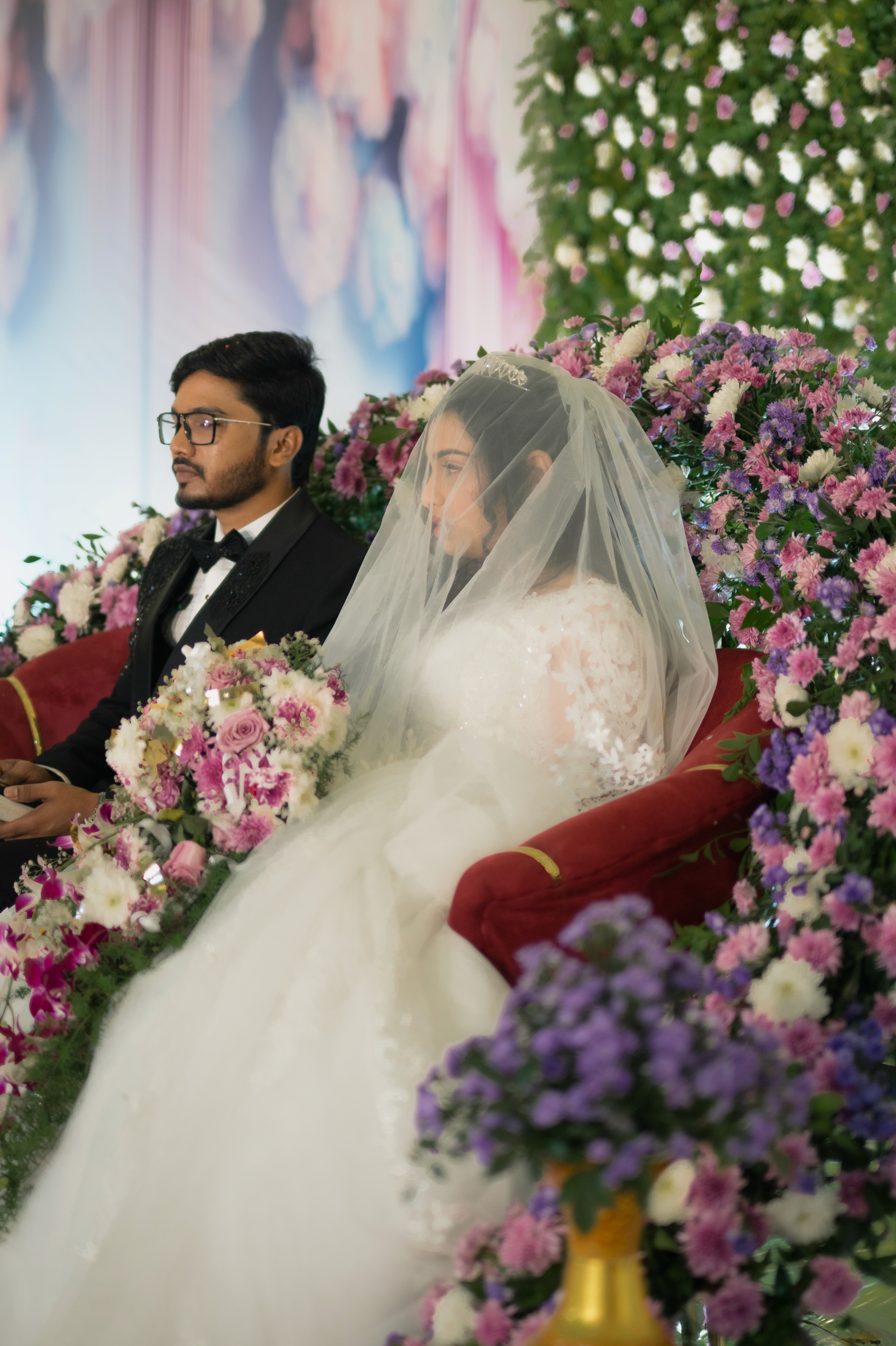 Christian wedding ceremony with bride in white gown and veil, photographed by Wow Makers wedding photography in Hyderabad, India.
