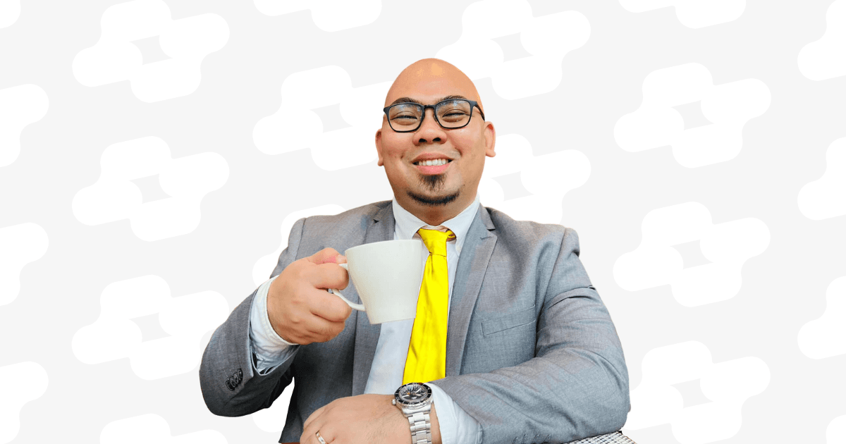 Kyle Tiamzon | Leadership Coach & Speaker - Kyle holding a white mug