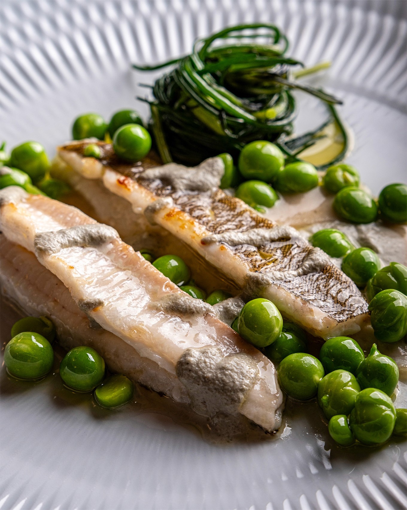 A smiling woman throwing a basketball