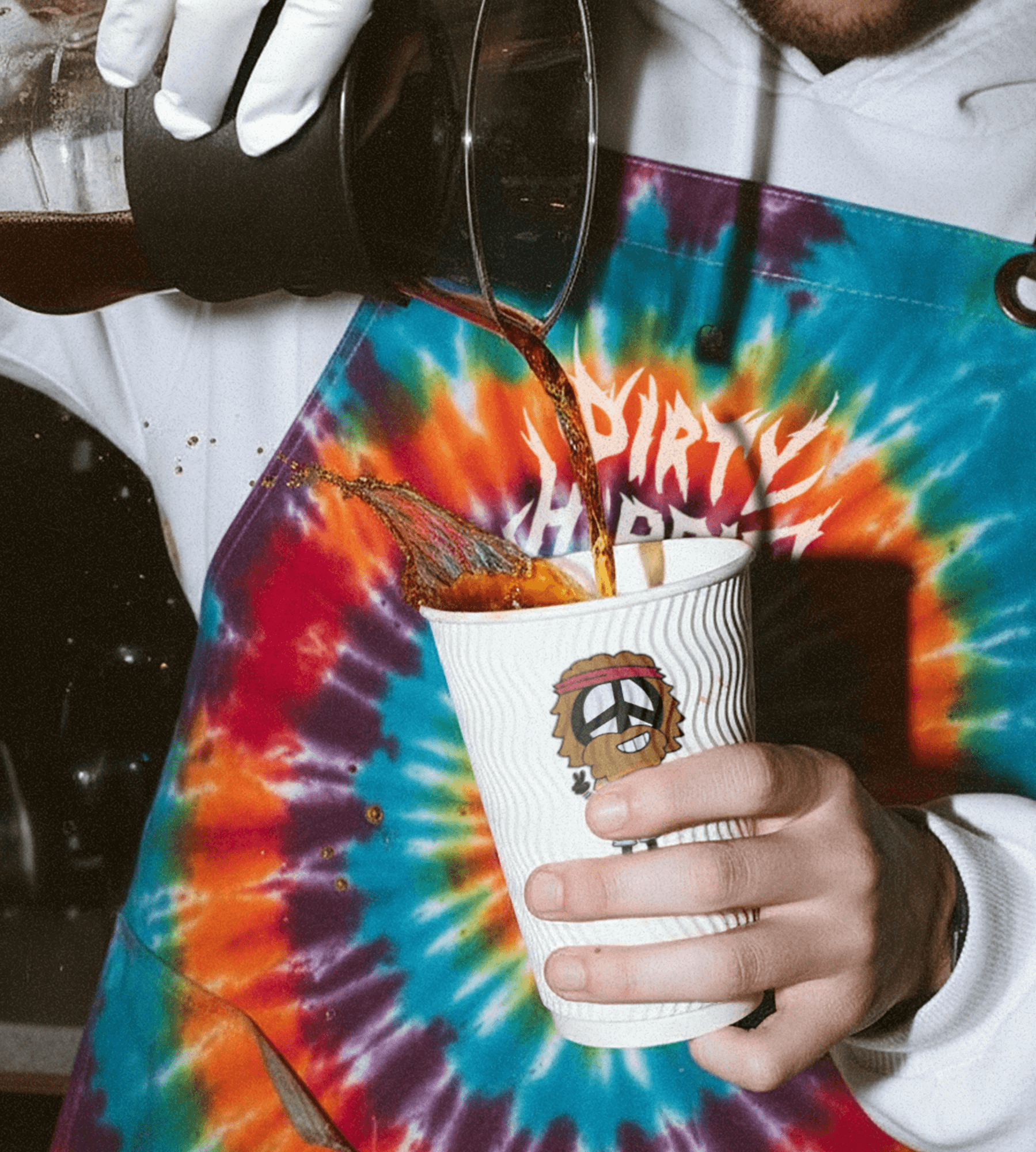 barista with glass in hand